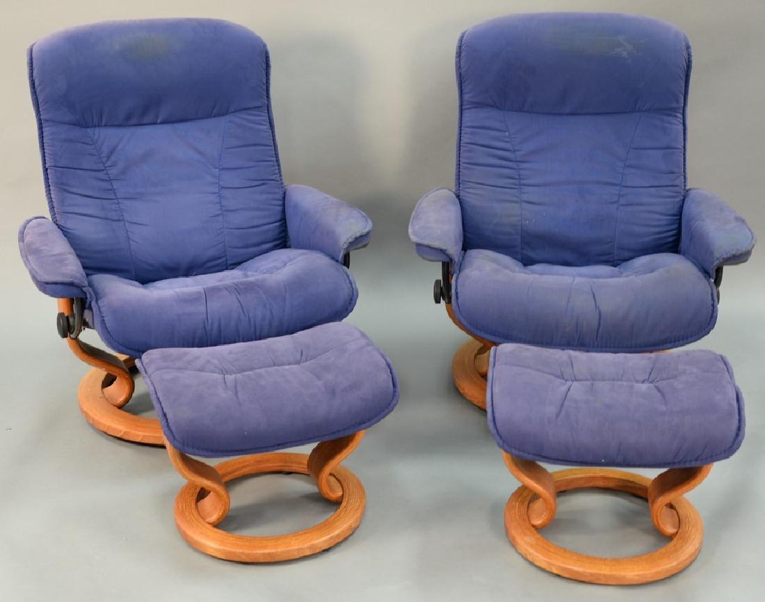 Pair of Contemporary swivel reclining chairs and: Pair of Contemporary swivel reclining chairs and ottomans.