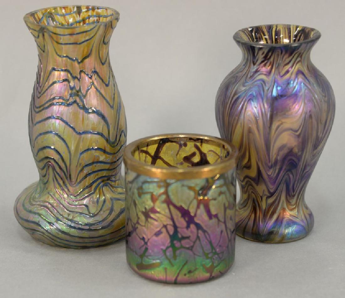 Attributed to Loetz, three art glass iridescent vases: Attributed to Loetz, three art glass iridescent vases including two small vases and a tooth pick holder. ht. 2 3/4in., 5in., & 5 1/2in.