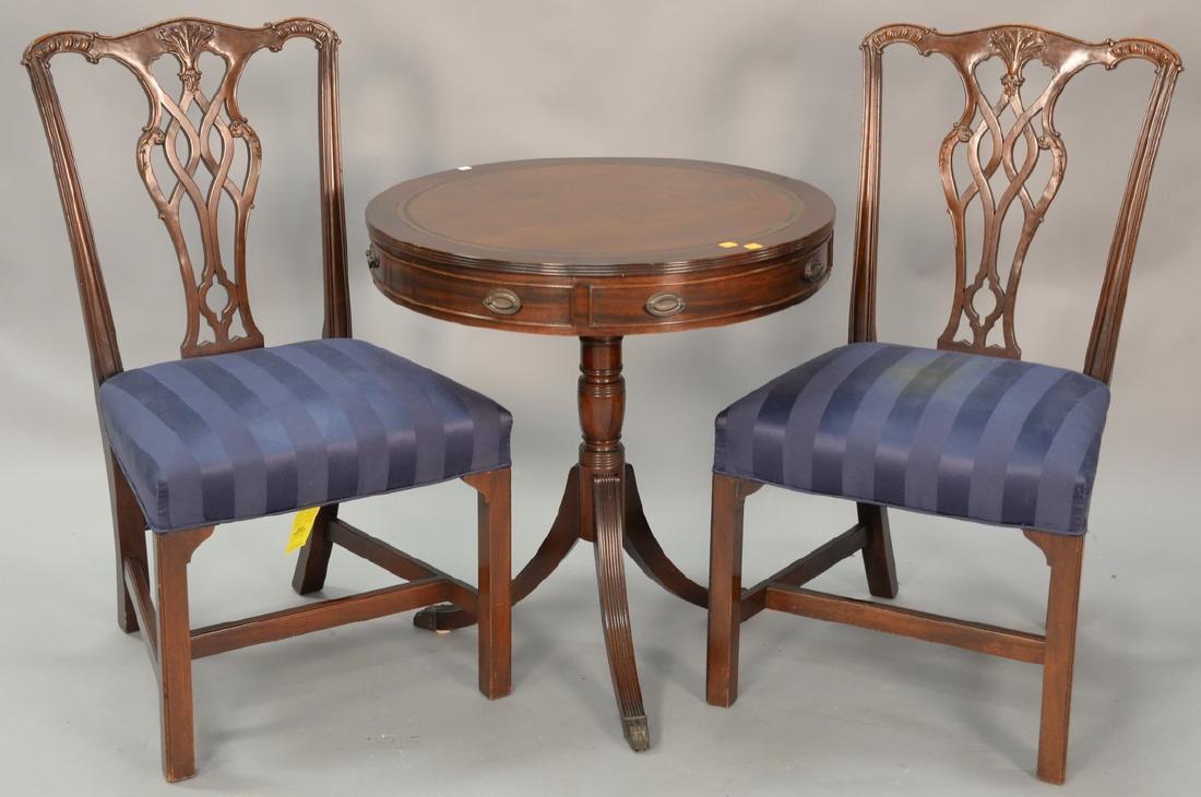 Kittinger three piece lot include two side chairs and a: Kittinger three piece lot include two side chairs and a drum table with leather top. dia. 27in.