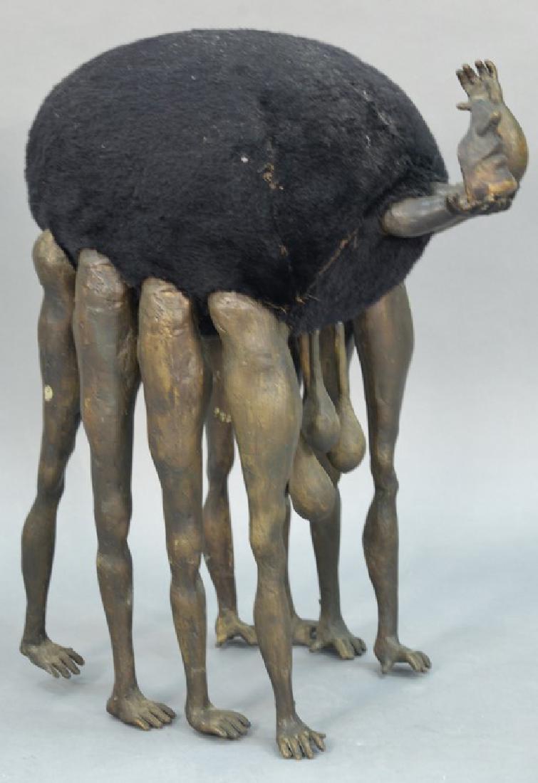 Bronze animal creature sculpture having short arms and: Bronze animal creature sculpture having short arms and hands holding partial mask face with round body over male anatomy, on eight arms and hands, manor of Pedro Friedeberg. height 27 inches, length 2