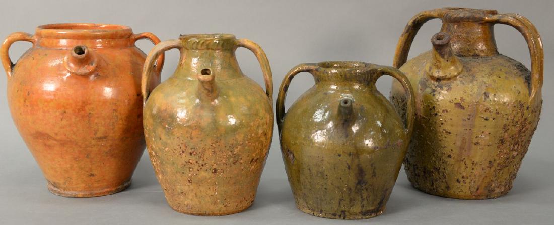 Four redware pots with handles and spouts, probably (1 of 9)