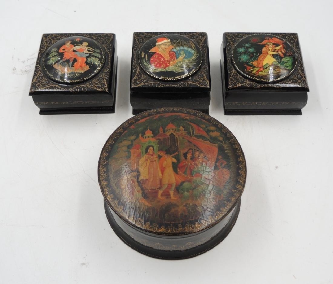 Four Russian Lacquer Boxes: Size: 2 1/2 x 2 1/4 x 1 1/2 in.; Diameter: 3 3/4 in., H: 1 7/8 in. Provenance: private Beverly Hills collection.