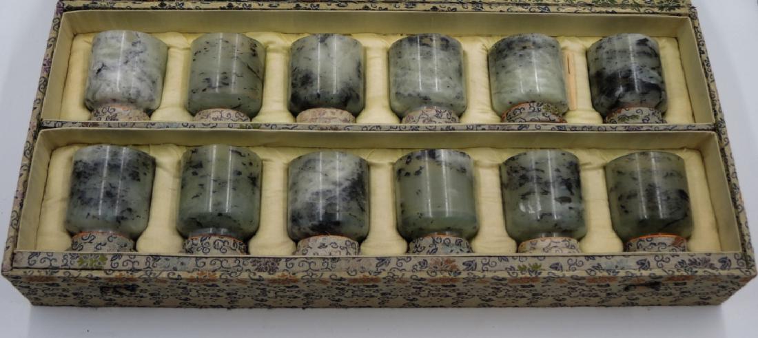 Set of 12 Chinese Carved Jade Cups: In original box. H: 2 1/4 in. Provenance: private Beverly Hills collection.