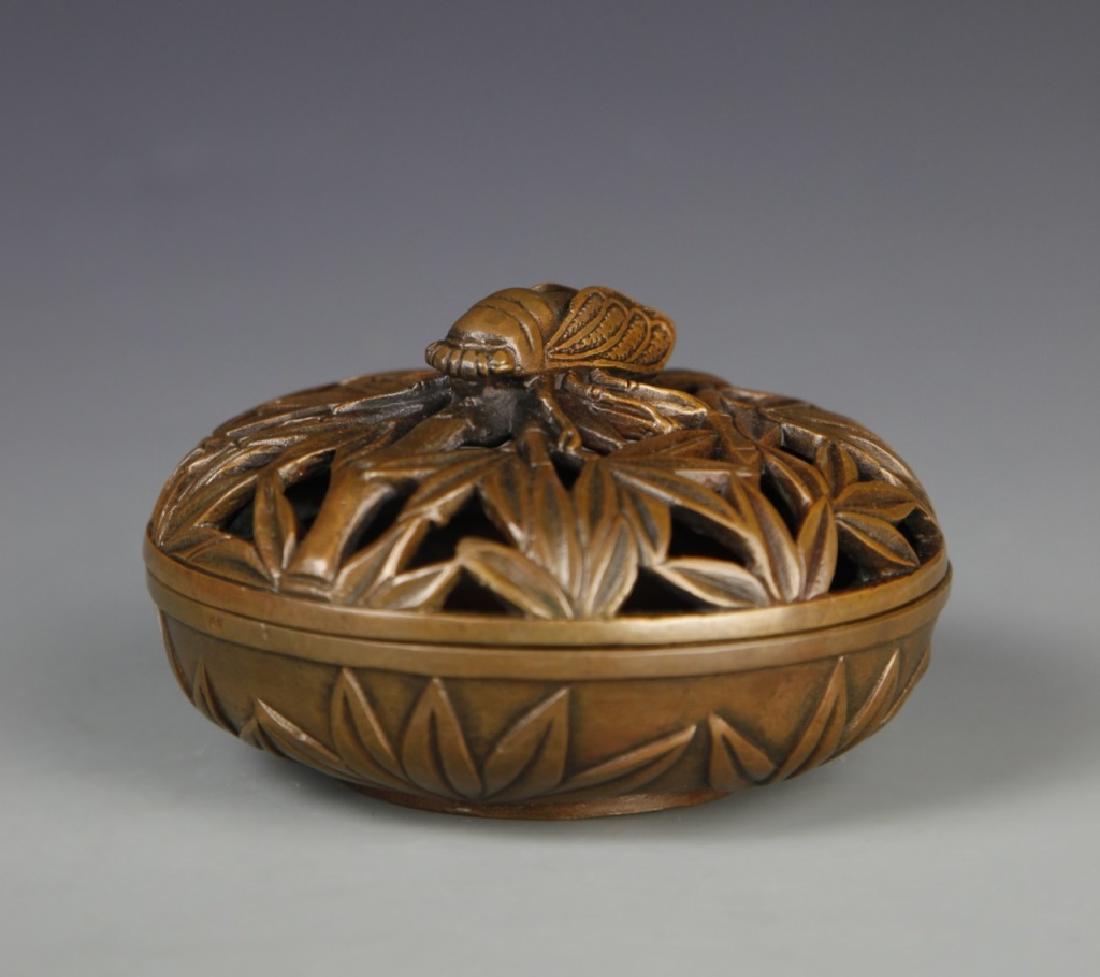 Chinese Bronze Censer With Lid: China, ROC., bronze censer, round body on flat base in two fitted halves, carved and pierced decoration forming the look of a nut surrounded by leaves, mark on base. Width 4 1/4 in., Height 2 1/2 in.