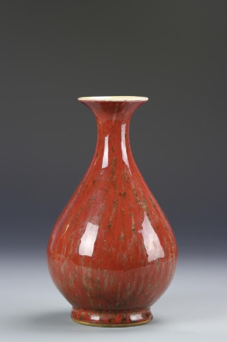 Chinese Oxblood Yuhuchunping Vase: China, 19th C., oxblood Yuhuchunping vase, with a circular foot on a raised concave base, tapering into an elongated neck ending in a fluted rim, double ring mark on base. Height 9 1/2 in.