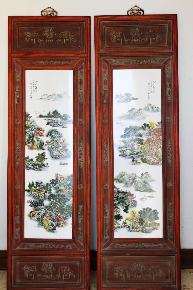 A fine pair of famille rose 'landscape' panels Wang: 47''x14'' Wang Yeting (1884-1942) One panel enamelled with a fisherman in a pink cloak on a low raft moored on a river under an overhanging cliff, the river receding into high domed mountains, the oth