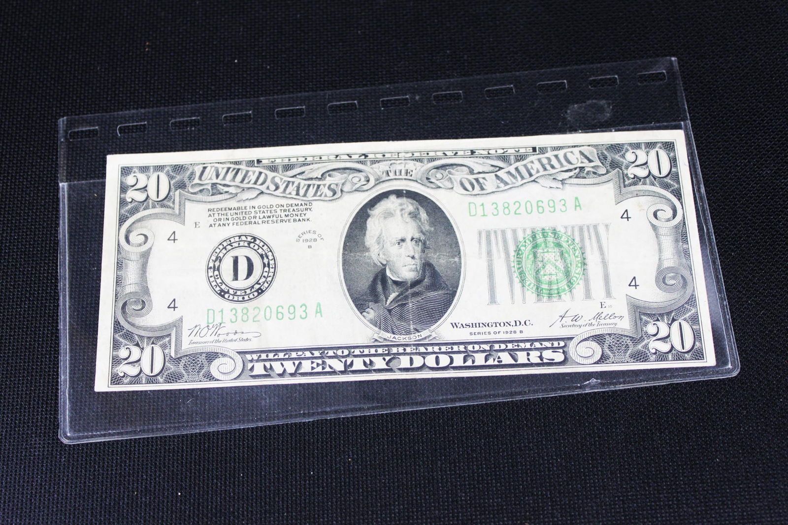 1928B $20 Federal Reserve Note – Green Seal – “Gold Redemption Clause: District: Federal Reserve Bank of Cleveland (D) Condition: VF–XF range (vertical/horizontal folds, edge wear, no major tears, good paper color) Special Feature: Has the early clause “Redeemable in