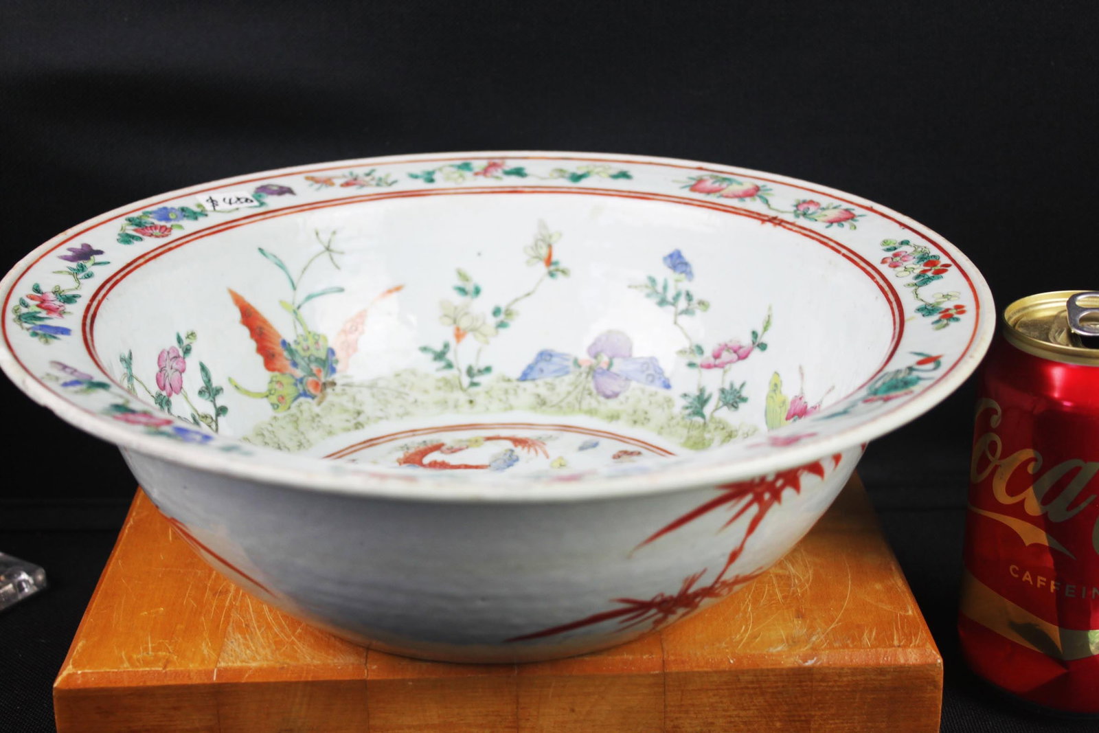 Large Chinese Famille Rose Porcelain Bowl: 12''x4'' This listing is for a large hand-painted Chinese porcelain bowl decorated in vibrant Famille Rose enamels. The bowl features an intricate central dragon encircled by multi-colored clouds and 