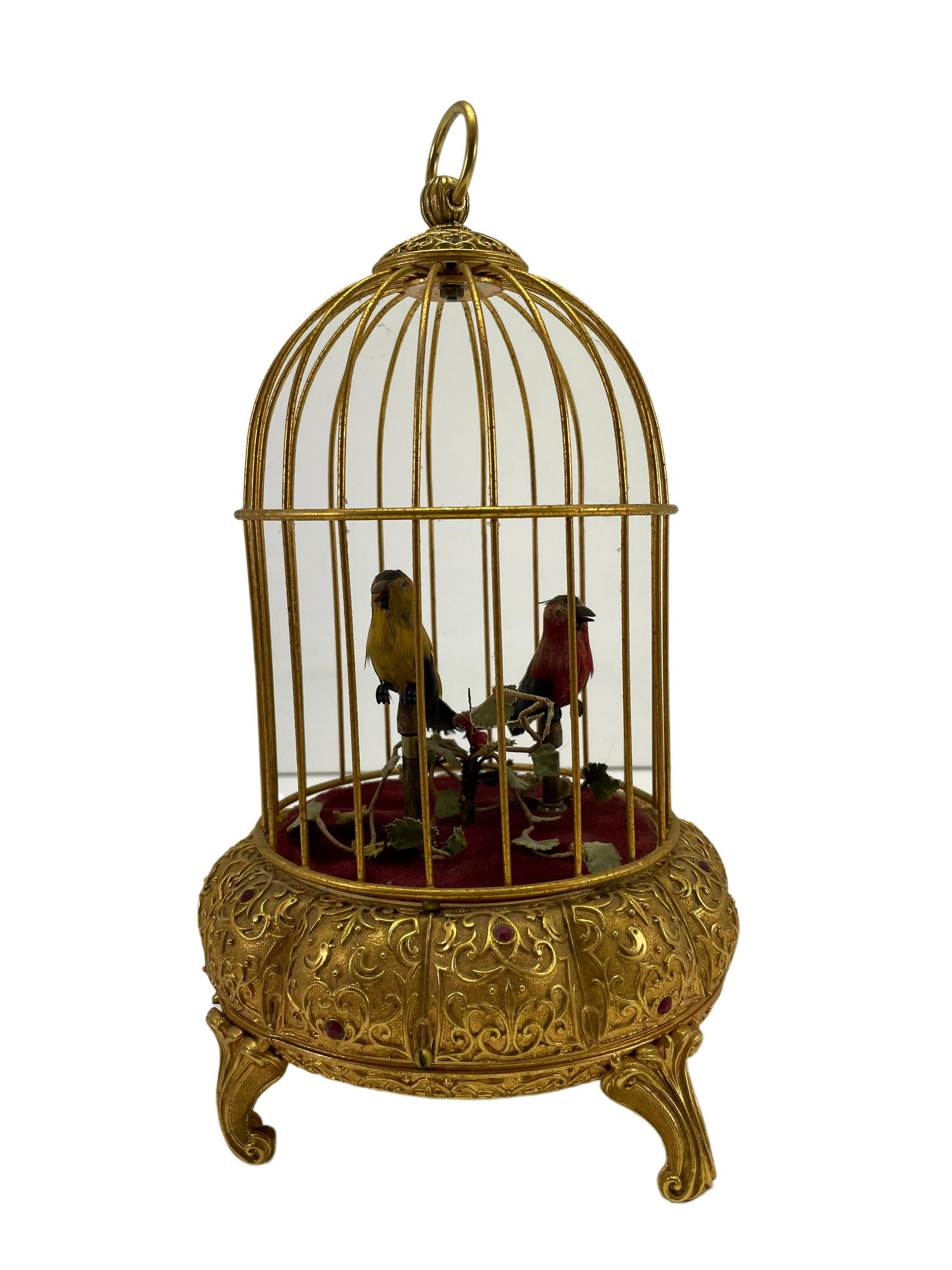 Antique Double Singing Bird Cage Automaton: Antique Double Singing Bird Cage AutomatonThe cage is 10" tall x 6" wide and has a jewel set base. When wounded the birds will move, flap feathers, and move their beaks. However, there is no singing o