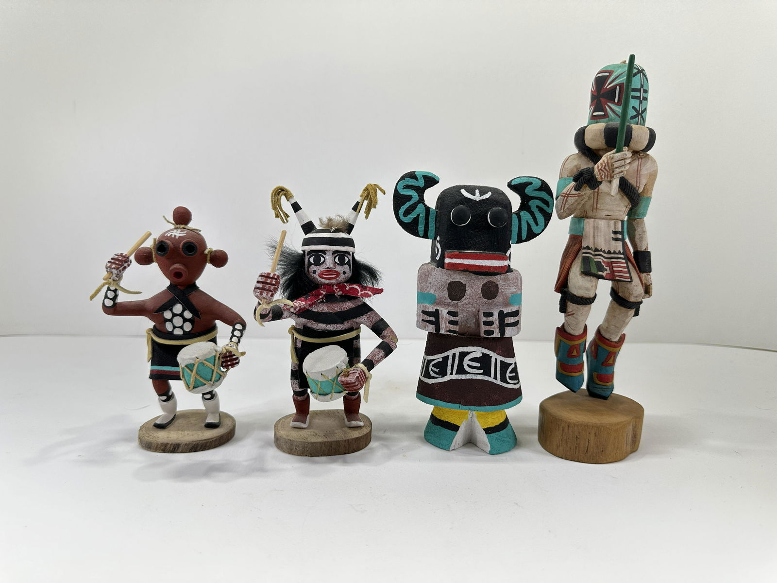 LOT OF 4 KACHINA DOLLS: LOT OF 4 KACHINA DOLLS. Mud Head Kachina Doll by A. Francis is signed on the bottom and is 5" Tall. Clown Kachina Doll by A. Francis is signed on the bottom, 1 arm is broken and is 5.5" Tall. Black Og