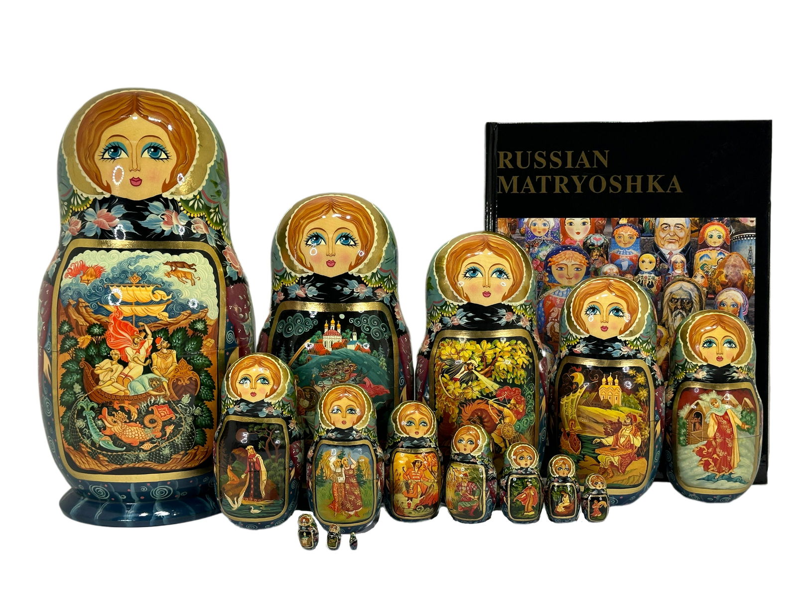 Monumental Russian Nesting Dolls & Book: Monumental Russian Nesting Dolls. 15 dolls, 3/8" to 11.5" tall. Russian Matryoshka book included.
