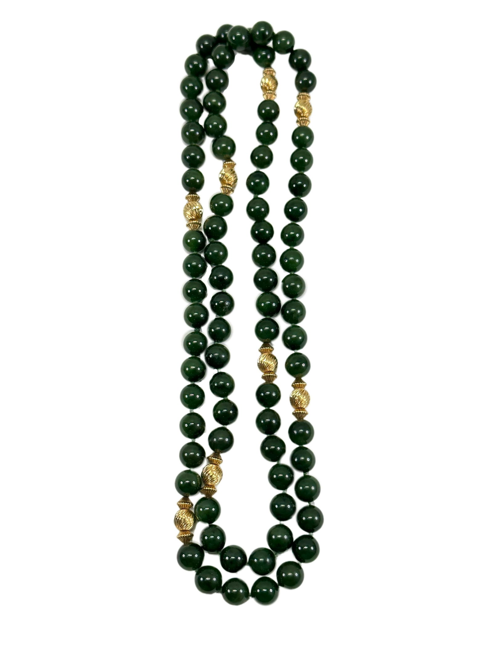 Vintage Long Strand of Jade Beads: Vintage Long Strand of Jade Beads. Necklace is 36" long, beads are approx. 10mm interspaced with gold fluted beads. Nice dark green color.