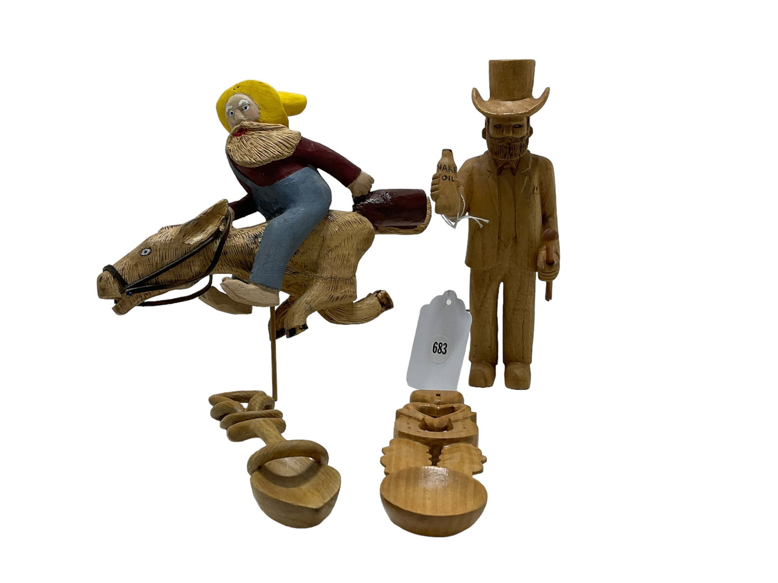 Lot of 4 Ralph O'Bryant Folk Art Items: Lot of 4 Ralph O'Bryant Folk Art Items. Spoons measure 7.5" tall, and men measures 8.5" tall and are signed "R" on bottoms. Man riding horse w/ jug is missing base