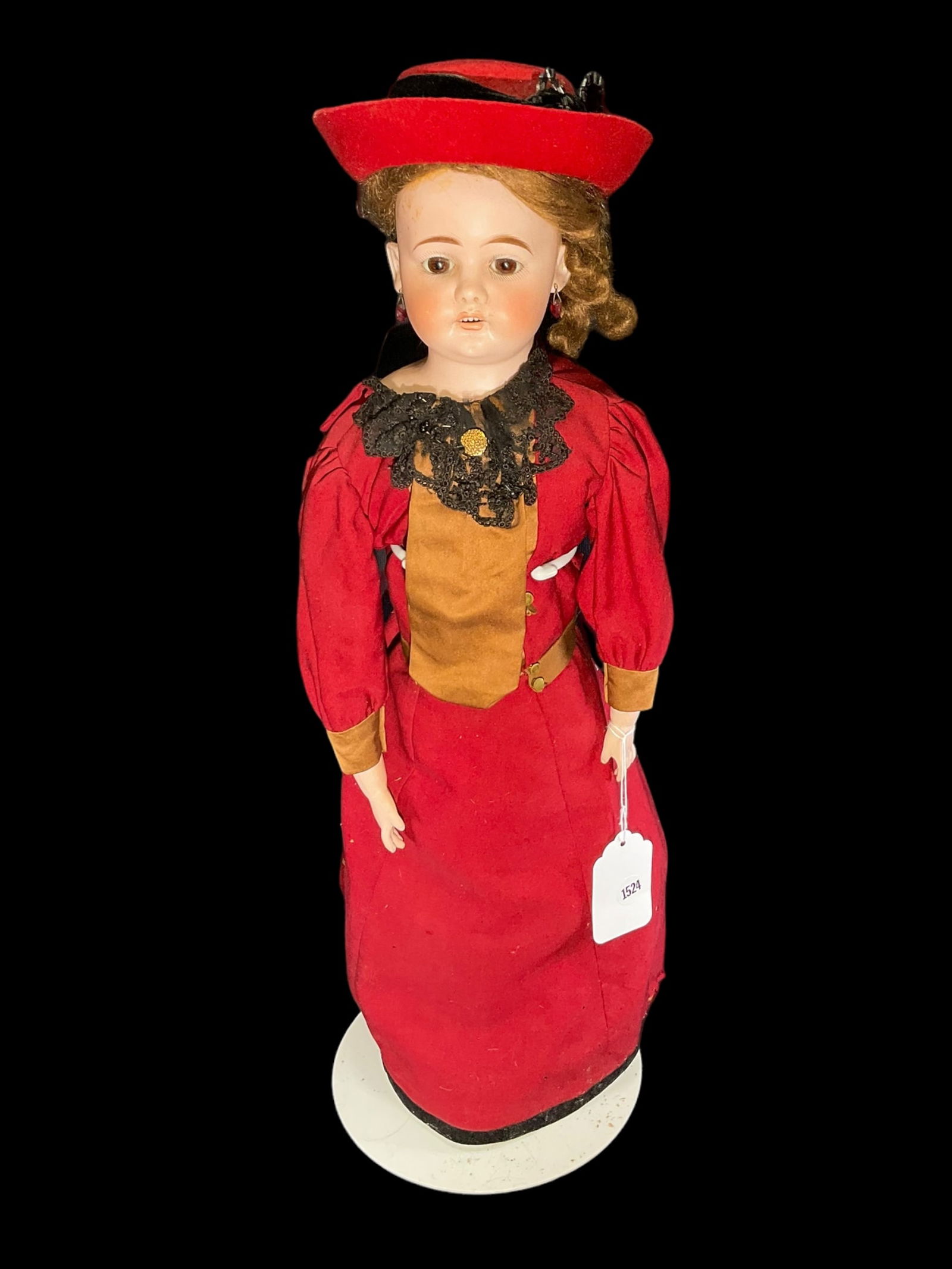 Antique Ernest Heubach Porcelain Doll: Antique Ernest Heubach Porcelain Doll. Measures 23" long and has a bisque porcelain head glass eyes and leather body. Has an open mouth Marked " x Made in Germany Hch 5 H with horseshoe symbol" on hea