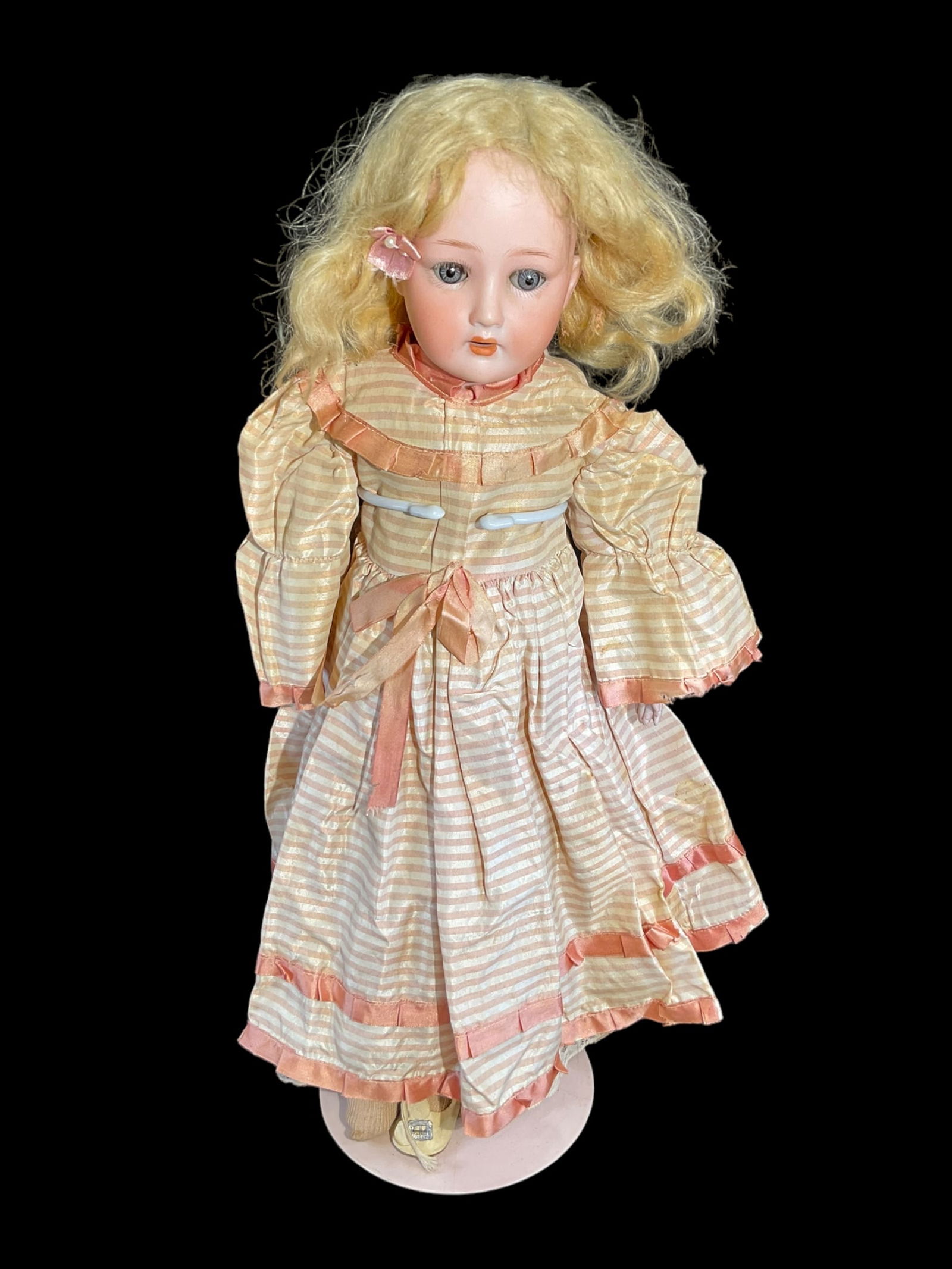 Antique Gebruder Ohlhaver Porcelain Doll: Antique Gebruder Ohlhaver Porcelain Doll. Measures 18" long and has a bisque porcelain head, sleepy glass eyes and leather body. Has an open mouth Marked " Eye in Triangle symbol Germany " on head. Ha