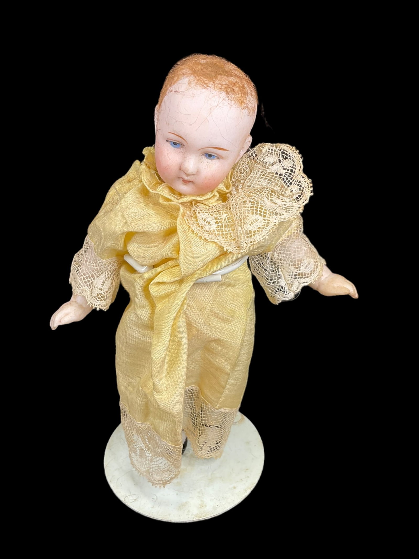 Small Antique Ernst Heubach Porcelain Doll: Small Antique Ernst Heubach Porcelain Doll. Measures 7" tall and has a bisque porcelain swivel head, painted eyes and porcelain body. Marked "573/4. Hair is not attached. Doll stands are NOT included.