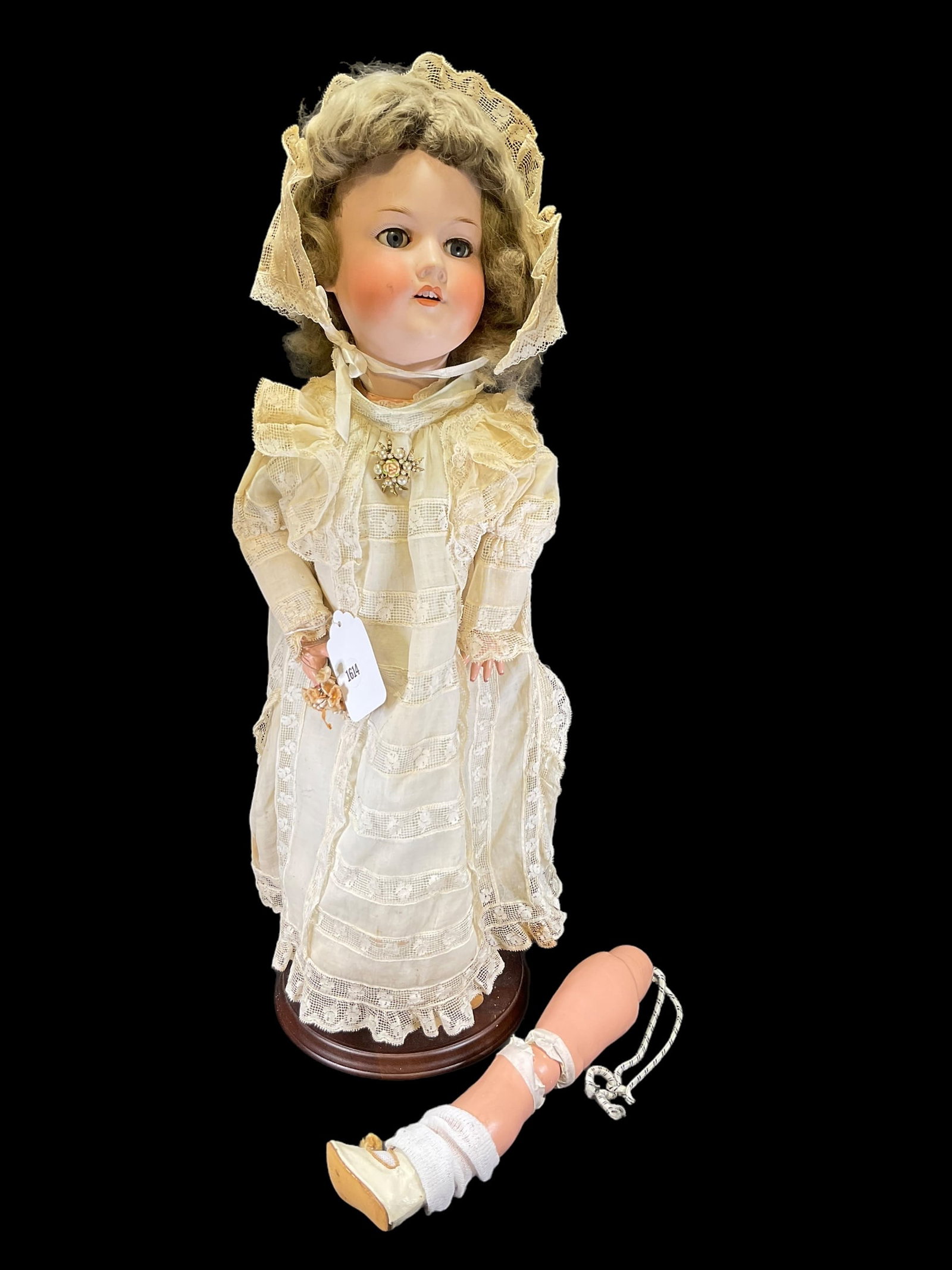 Antique Armand Marseille Porcelain Doll: Antique Armand Marseille Porcelain Doll. Measures 24" tall and has a bisque porcelain head, composition body and glass eyes. Marked "390 Germany A,9,M" and needs repaired. Doll stands are NOT included