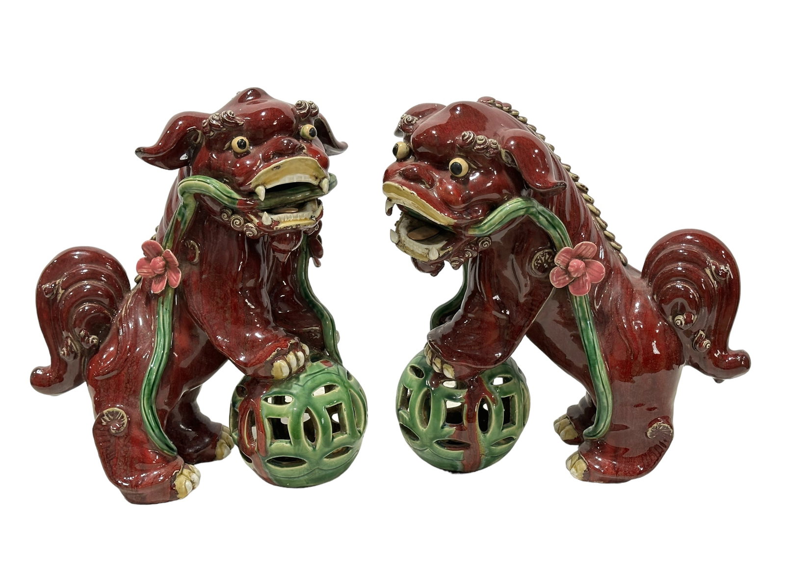 Pair of 1920's Foo Dogs w/ Vine in Mouth: Pair of Foo Dogs w/ Vine in Mouth. Measures 16" x 13".
