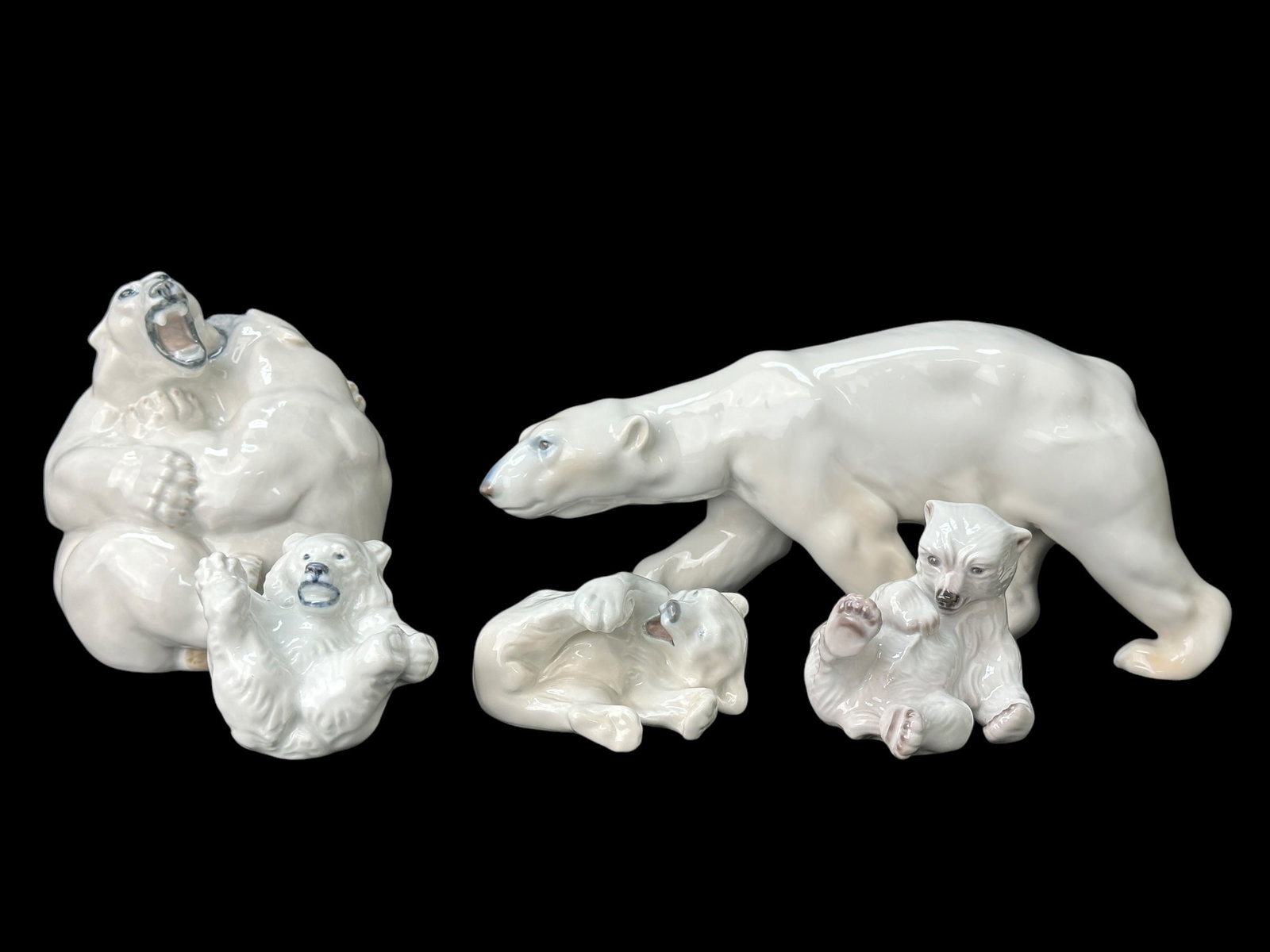Group of 5 Royal Copenhagen Polar Bears: Group of 5 Royal Copenhagen Polar Bears. All marked Royal Copenhagen on the bottom. Measurements range from 2.25" - 6.25" Tall.