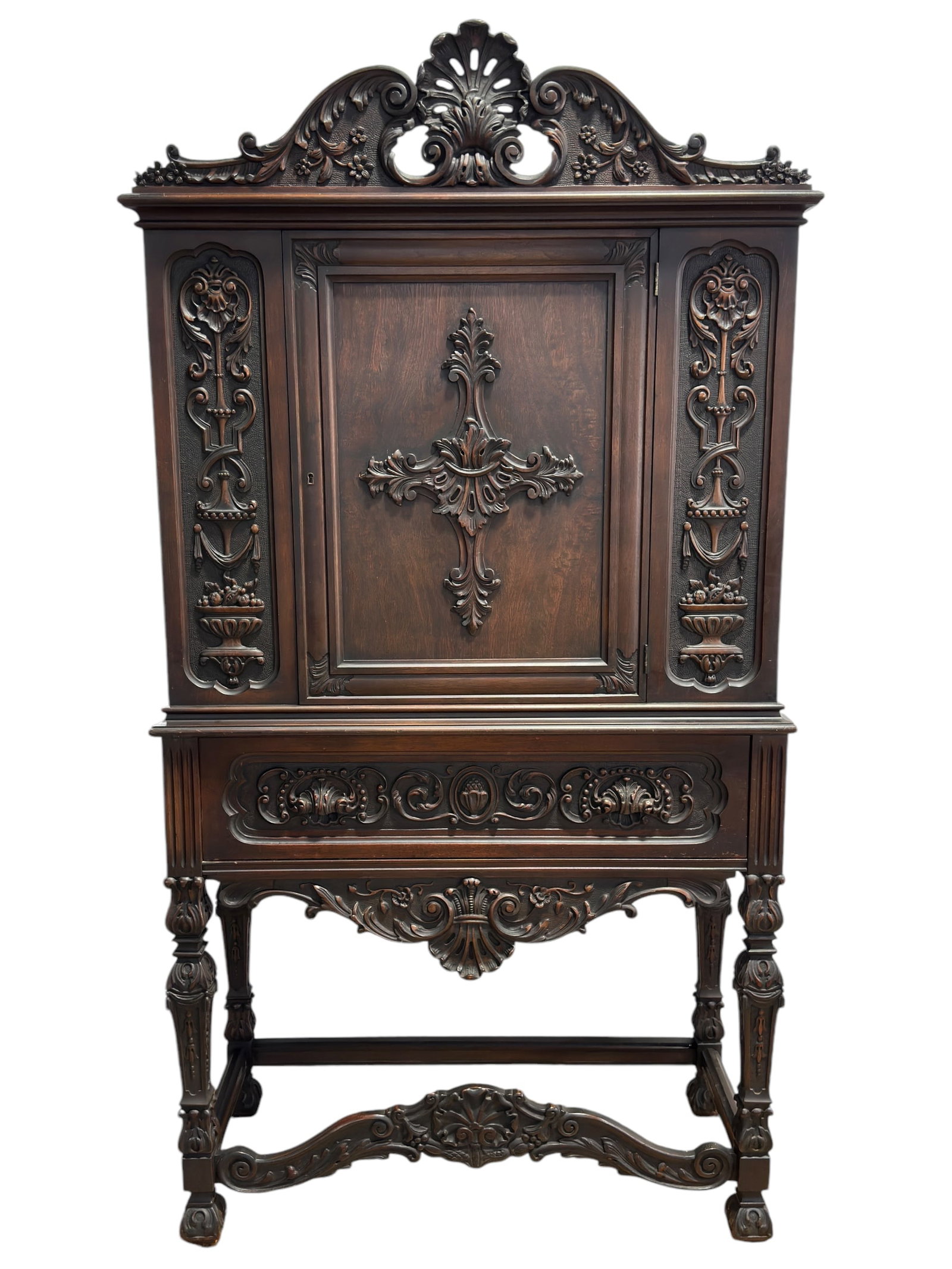 Mahogany Wood Carved Jacobean Cabinet: Mahogany Wood Carved Jacobean Cabinet. Measures 74" H x 39" W x 16.75" D.