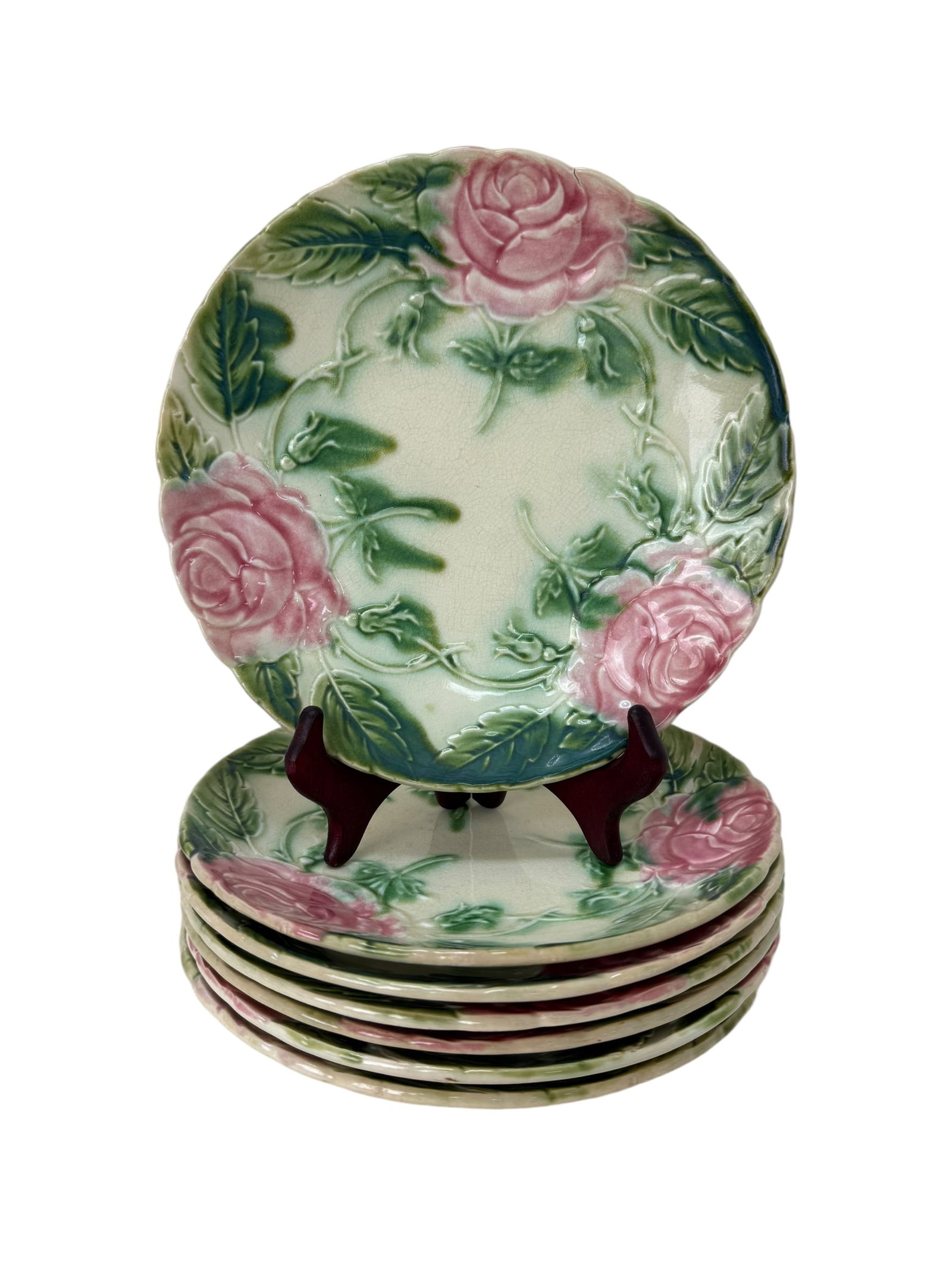 7 Antique French Majolica Pink Rose Plates: 7 Antique French Majolica Pink Rose Plates. Victorian Pottery plates from France. Each plate measures 8.25" Diameter.