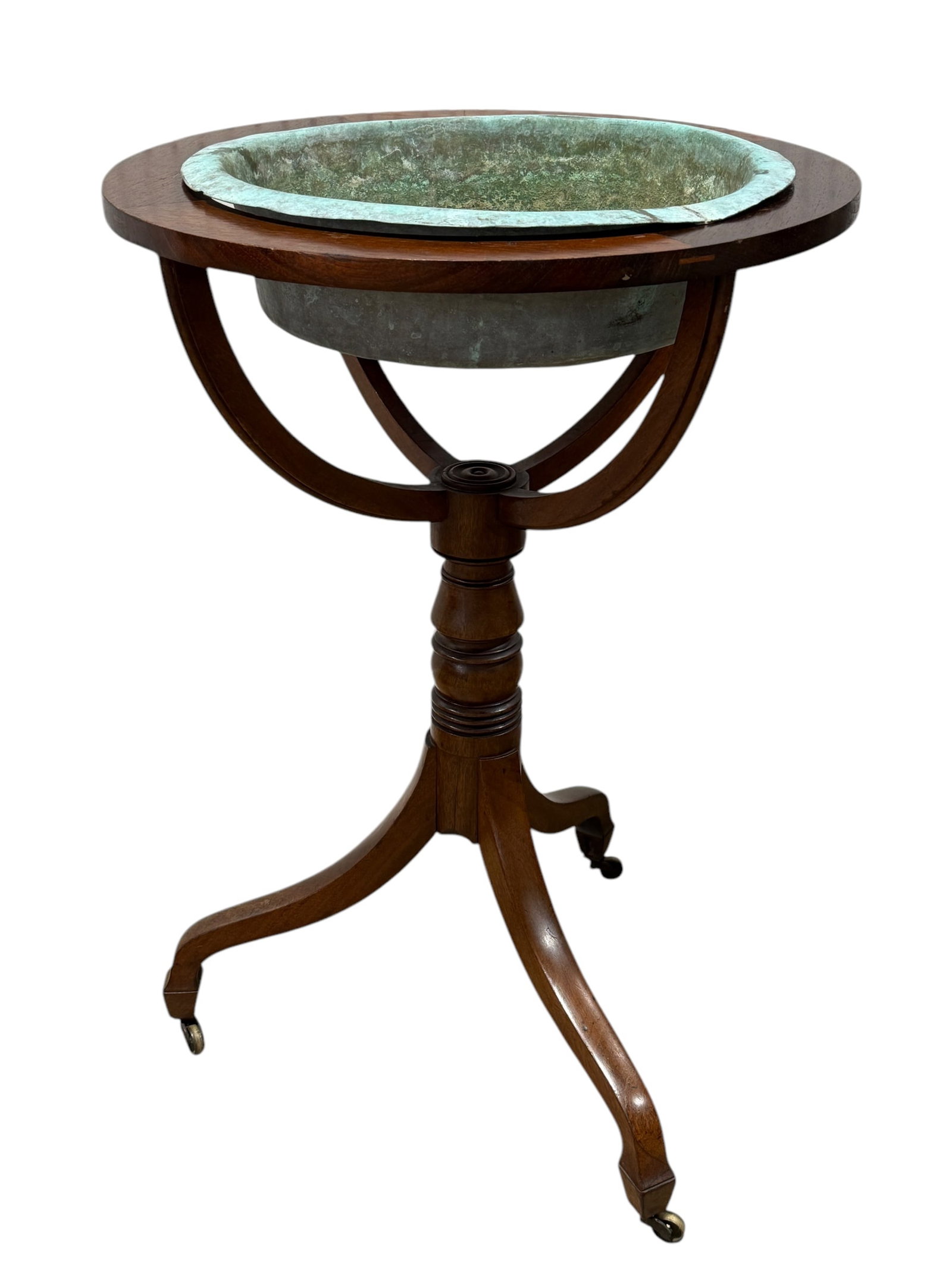 Antique Copper Bowl Pedestal Stand: Antique Copper Bowl Pedestal Stand. On casters. Measures 30" H x 20.75" W x 20.75" D.