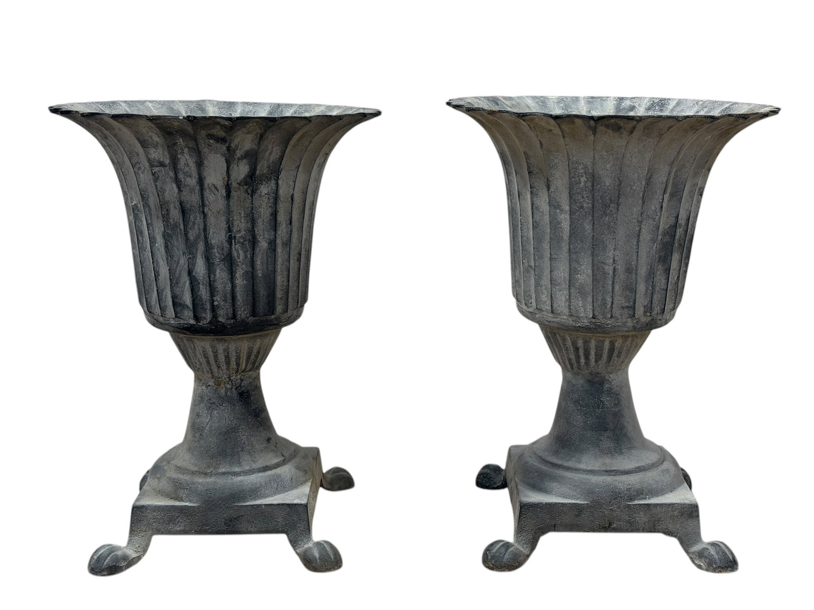 Pair of Cast Iron Outdoor Planters: Pair of Cast Iron Outdoor Planters. Measures 23.25" H x 17" W x 17" D.