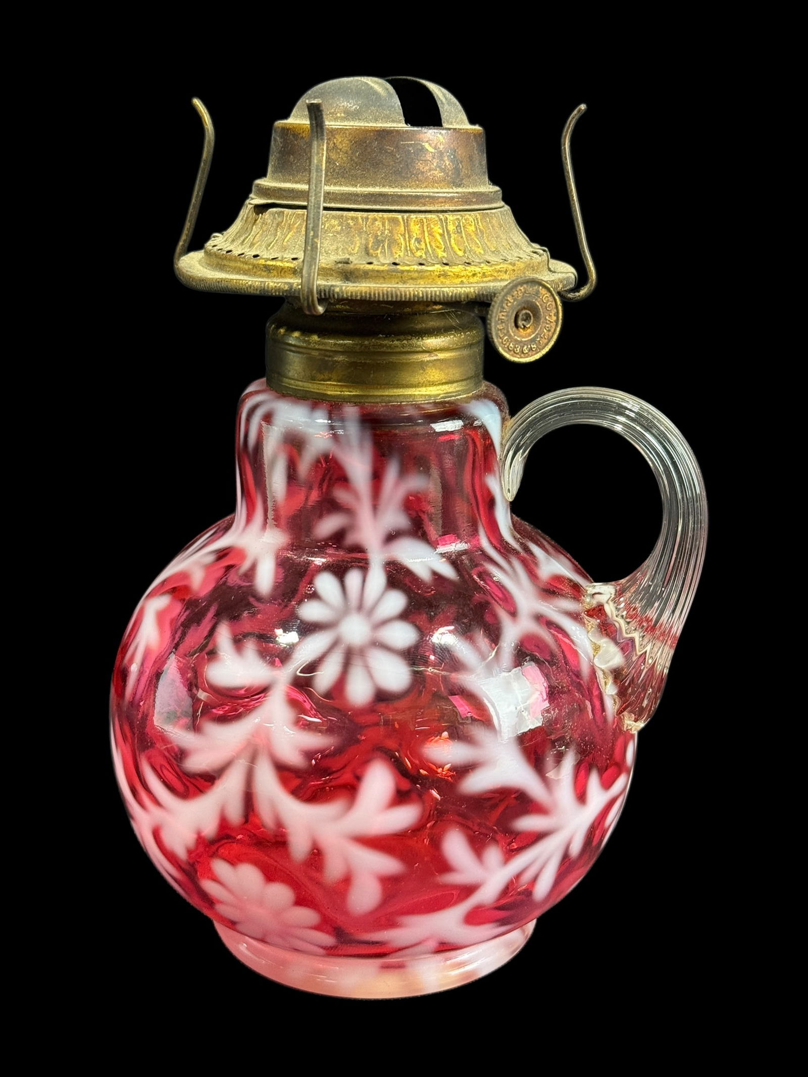 Fenton Cranberry Opalescent Daisy & Fern Oil Lamp: Fenton Cranberry Opalescent Daisy & Fern Oil Lamp. Measures 7.25" Tall.