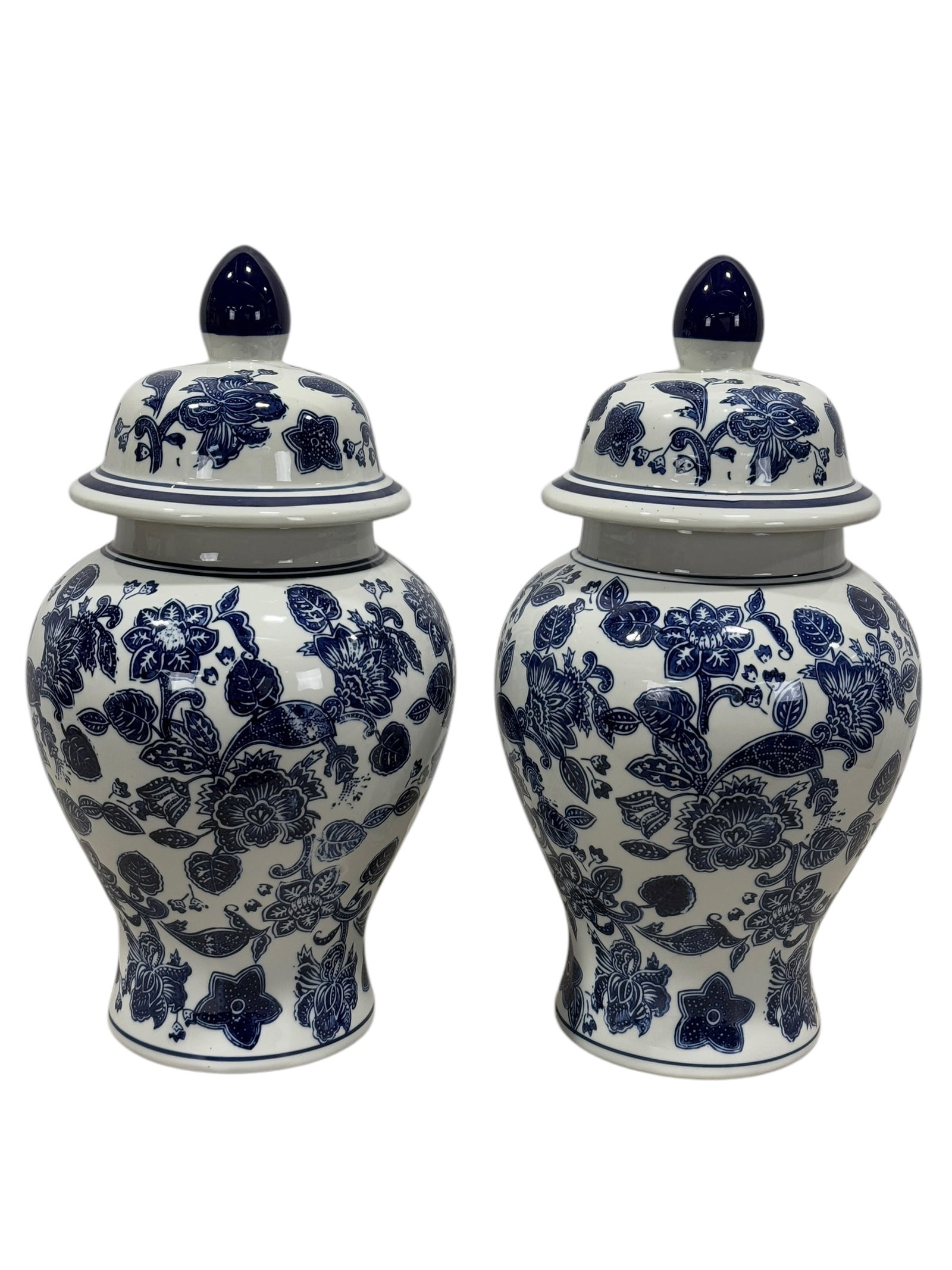 Pair of Blue & White Floral Design Lidded Urns: Pair of Blue & White Floral Design Lidded Urns. Measures 18" Tall.