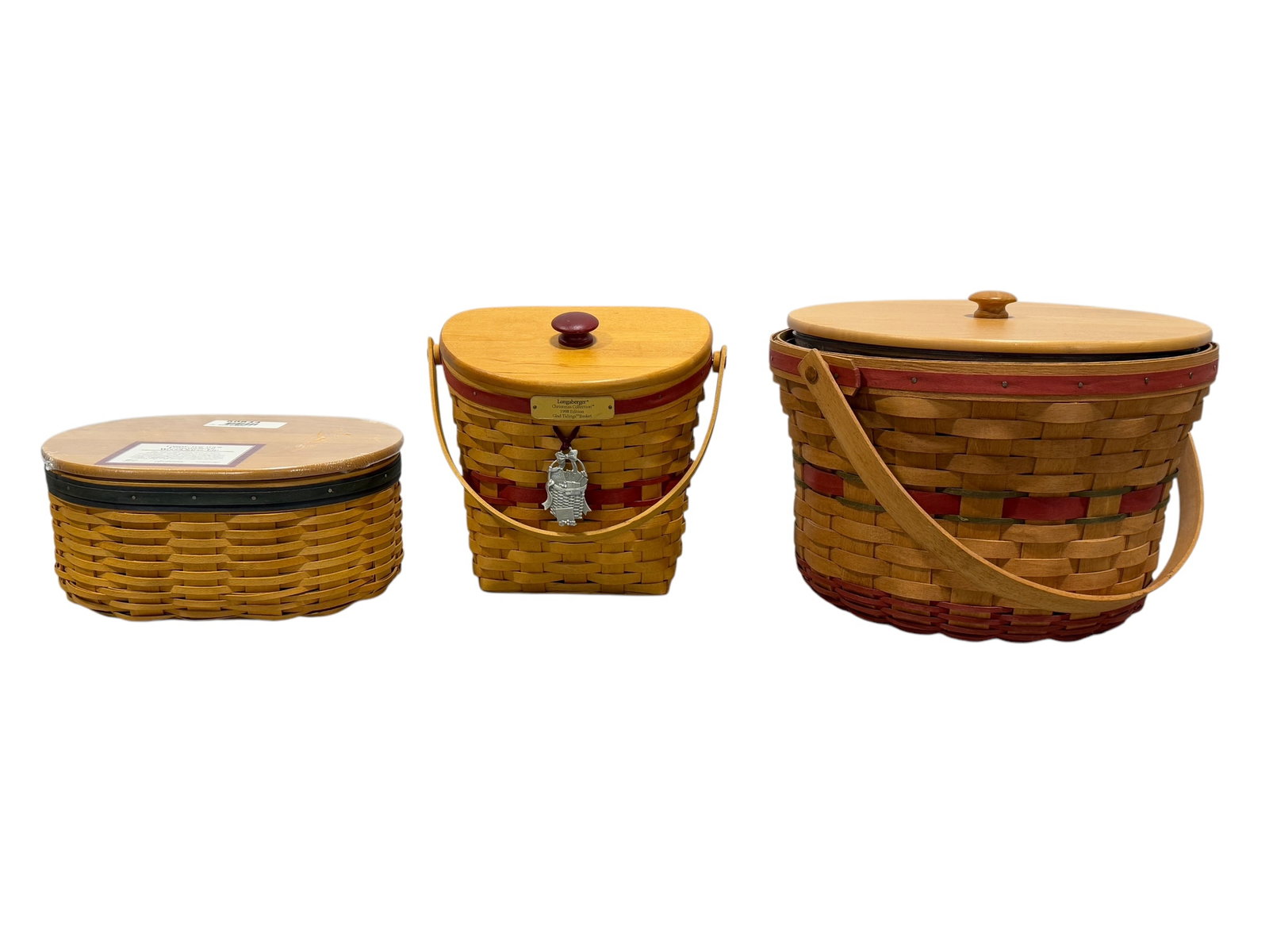 Group of 3 Longaberger Baskets: Group of 3 Longaberger Baskets. Measurements follow as pictured: 5" H x 11" W x 8.75" D, 9" H x 9.75" W x 6.25" D & 9.5" H x 14.5" W x 13" D.