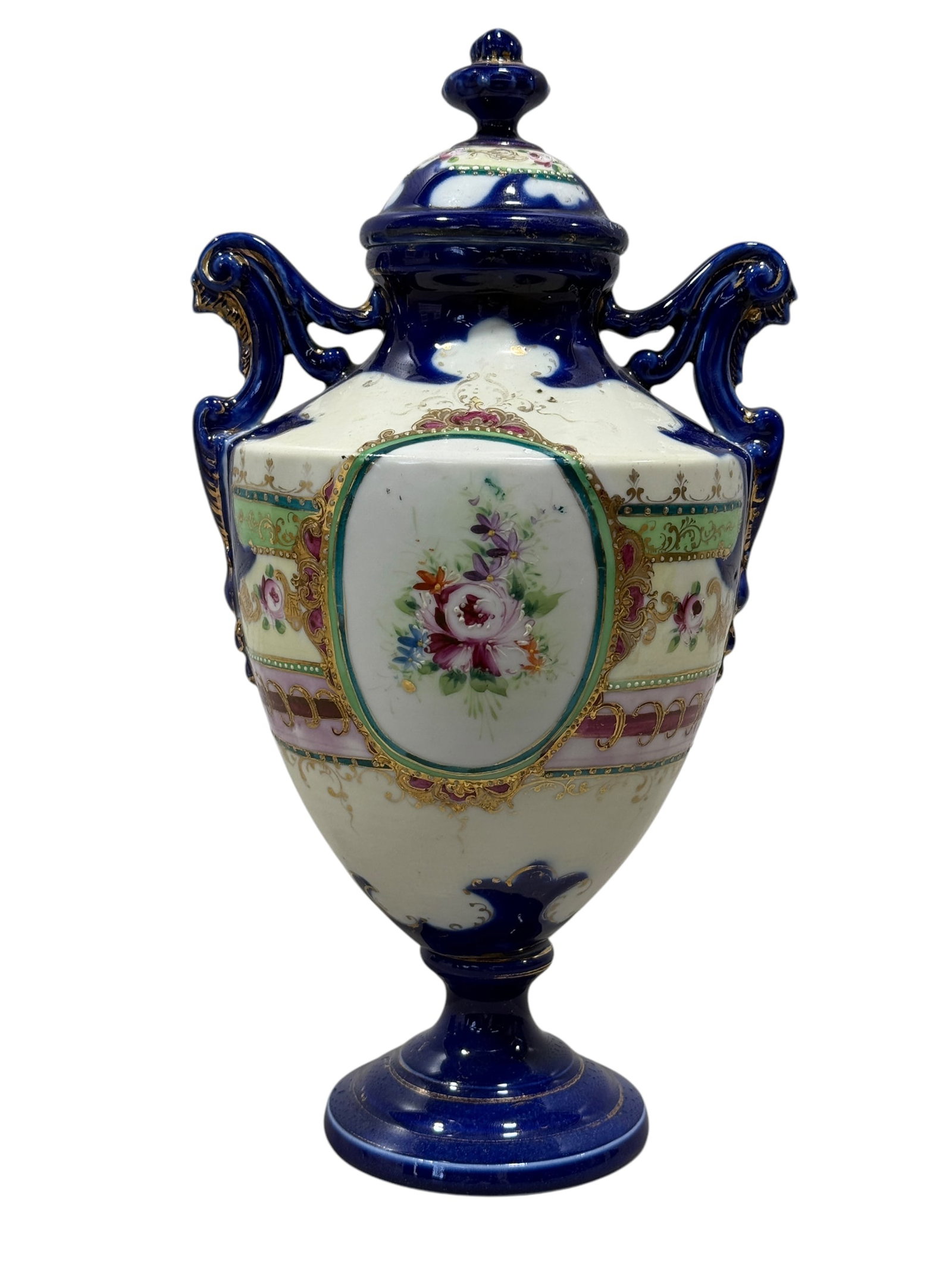 Royal Vienna Style Cobalt Blue Porcelain Urn: Royal Vienna Style Cobalt Blue Porcelain Urn. Measures 12.25" H x 6.75" W x 5.5" D.