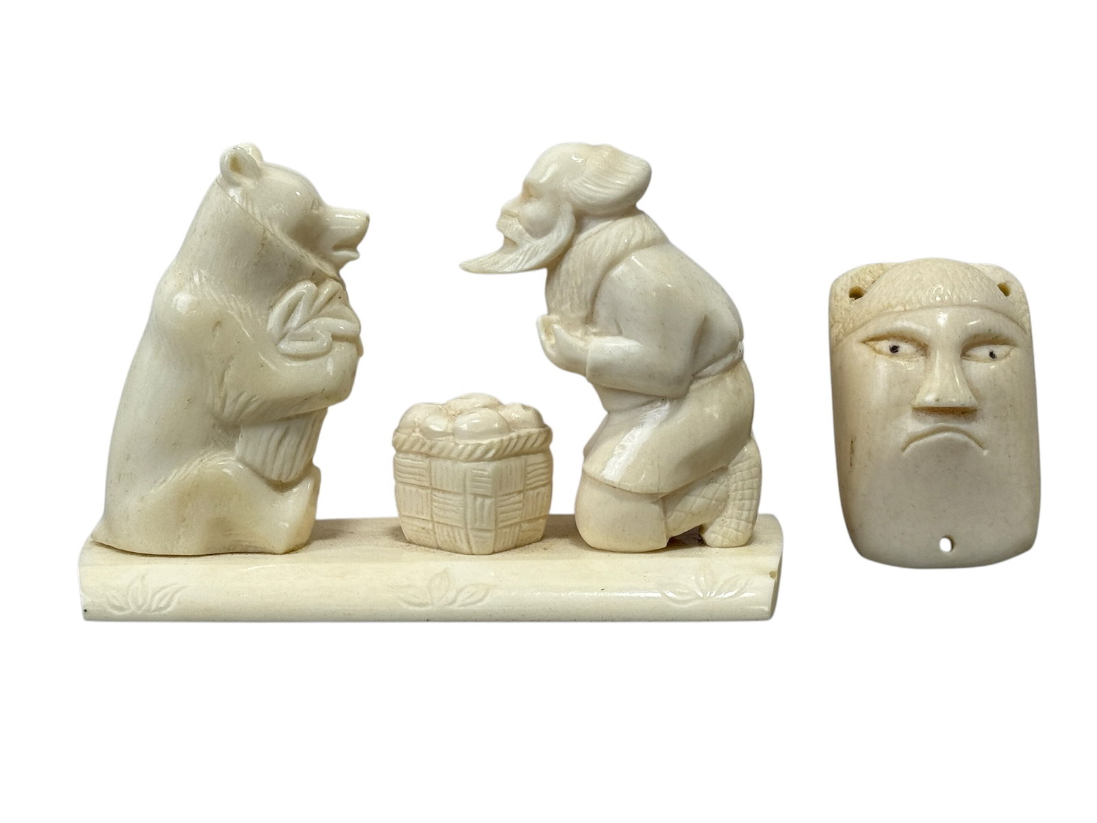 2 Carved Bone Pieces: 2 Carved Bone Pieces. Carved Bone Bear and Man & Carved Bone Pendent.