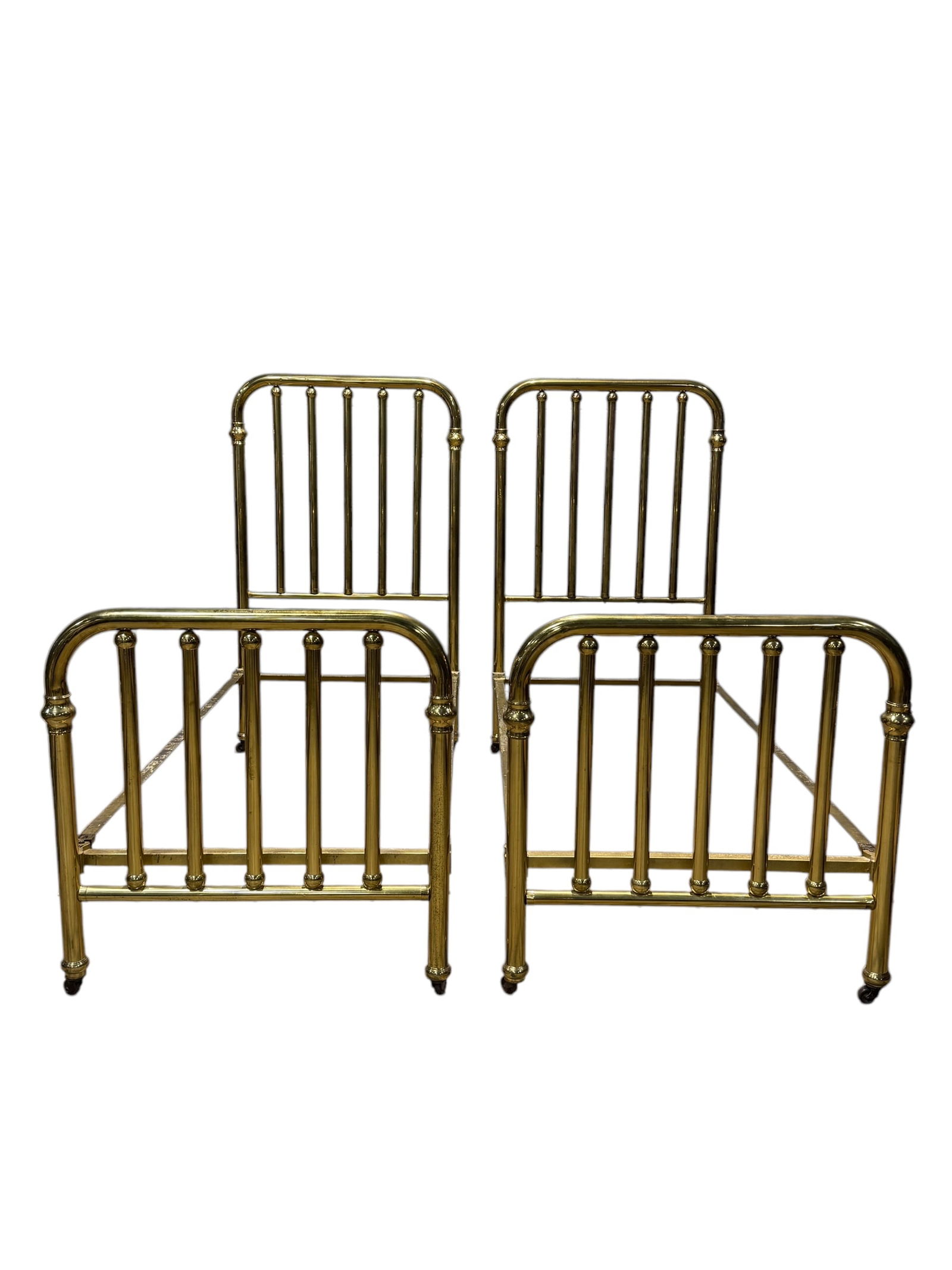 Pair of Antique Brass Twin Beds: Pair of Antique Brass Twin Beds. Measures 61.5" H x 36.5" W x 80" D each.