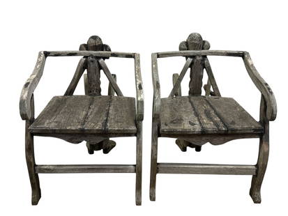 Pair of Antique African Tribal Figural Carved Arm Chairs: Pair of Antique African Tribal Figural Carved Arm Chairs. Measures 30" H x 22" W x 32" D.