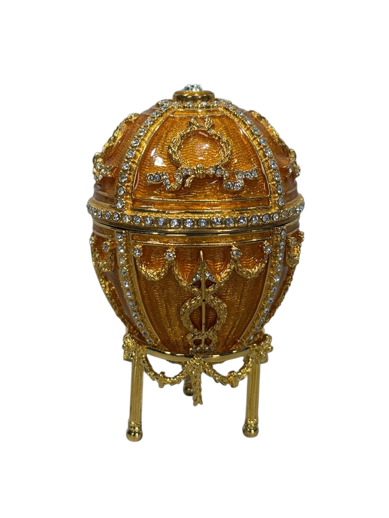 Signed Faberge 'Imperial Rosebud' Enamel Egg w/ Orig Box: Signed Faberge 'Imperial Rosebud' Enamel Egg w/ Orig Box. 24 karat gold finish. Orange guilloche enamel and clear gemstones. The egg shows on the inside, a rosebud with a removable chain pendant insid