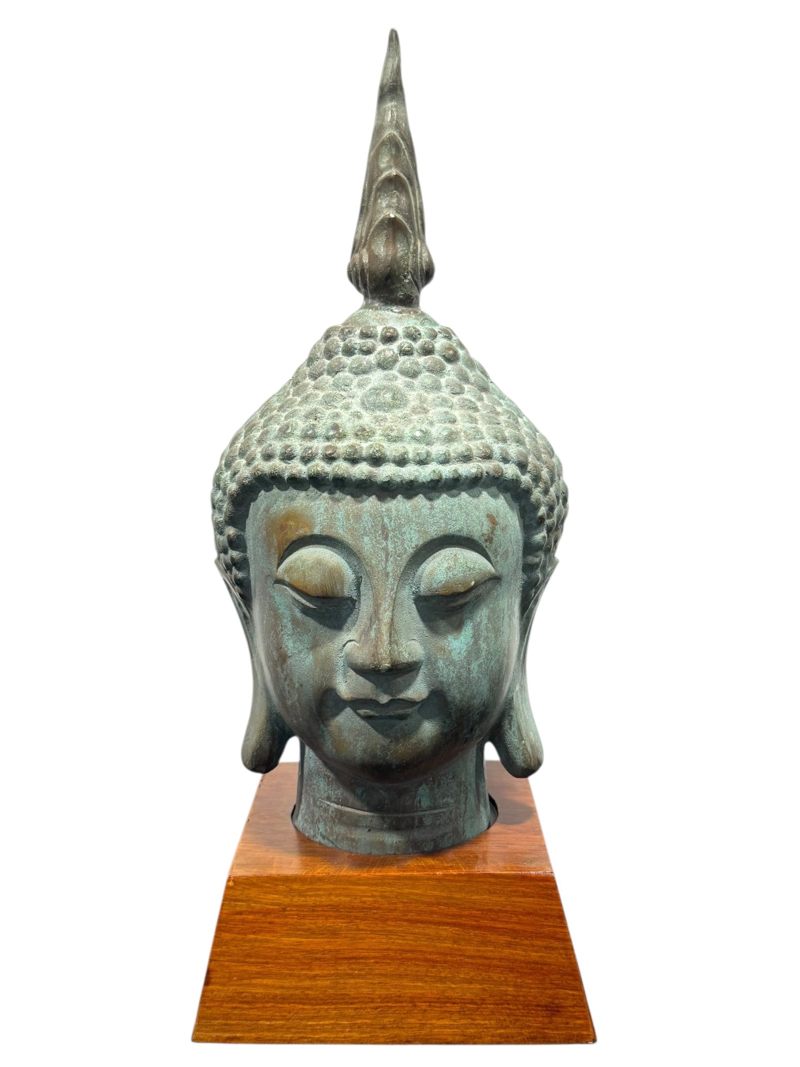 Late 19th C. Bronze Buddha Head Statue on Wood Base: Late 19th C. Bronze Buddha Head Statue on Wood Base. Bronze is hollow and showing patina. Overall measures 17.5" H x 7" W x 6.25" D.