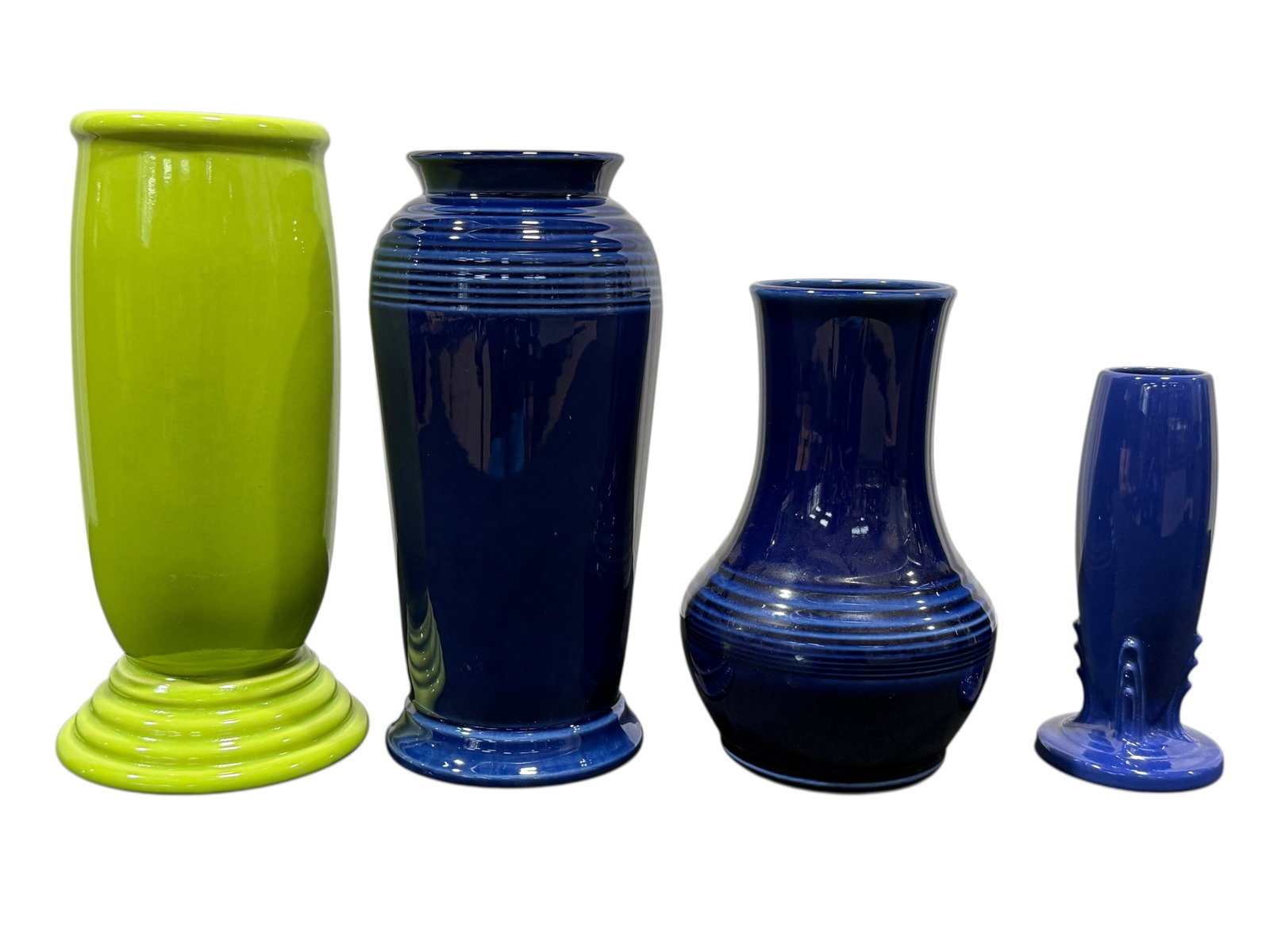 Group of 4 Fiesta Ware Vases: Group of 4 Fiesta Ware Vases. All marked on the underside. Measures 6.25" H, 7.5" H, 9.25" H & 9.75" H.
