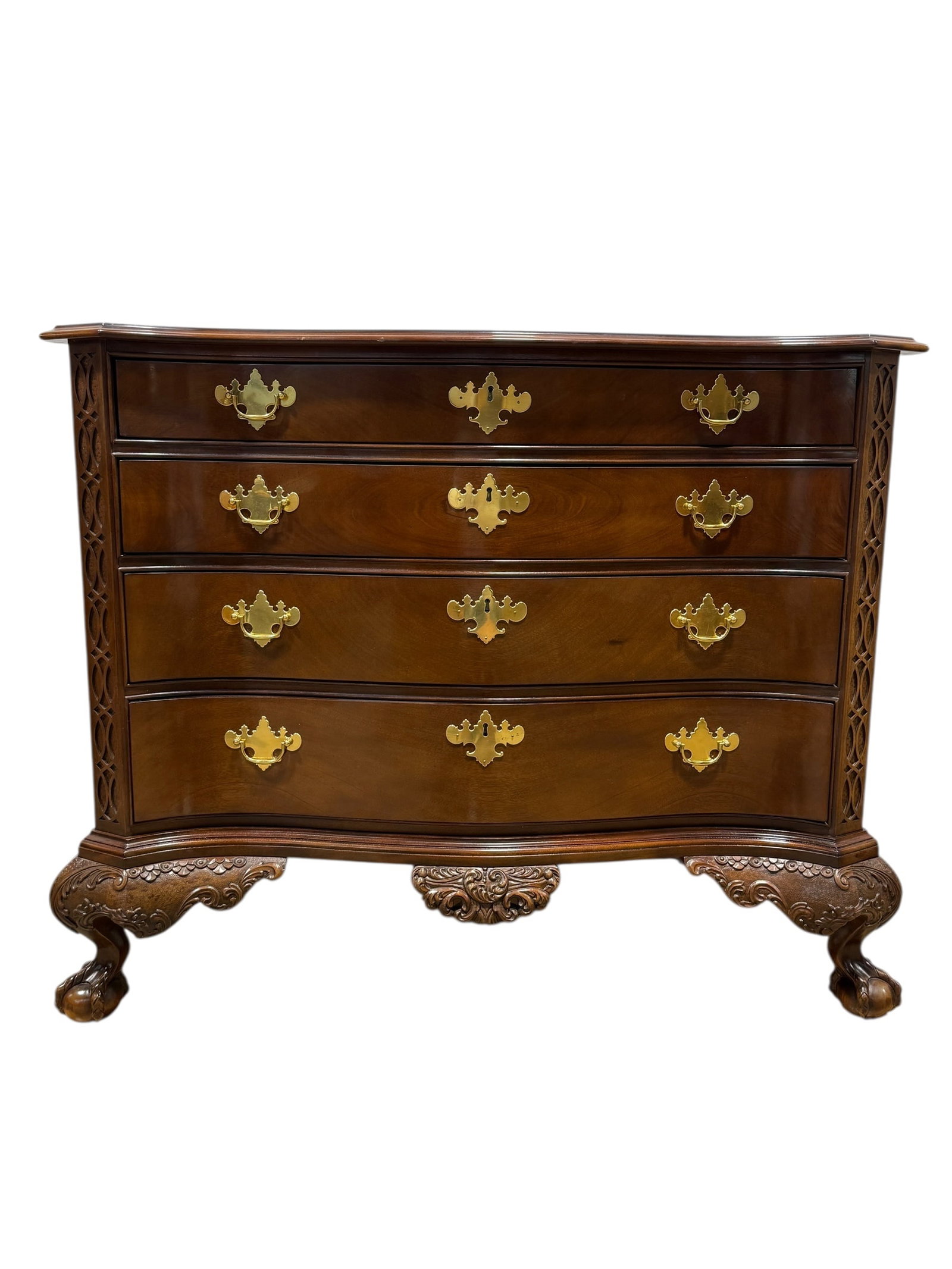 Sutton Ball & Claw Mahogany Needham Serpentine Chest: Sutton Ball & Claw Mahogany Needham Serpentine Chest. Brass plate label in top drawer with paper work. Serpentine top with concave sweep, carved cartouche, chippendale fretwork with star punch and dra