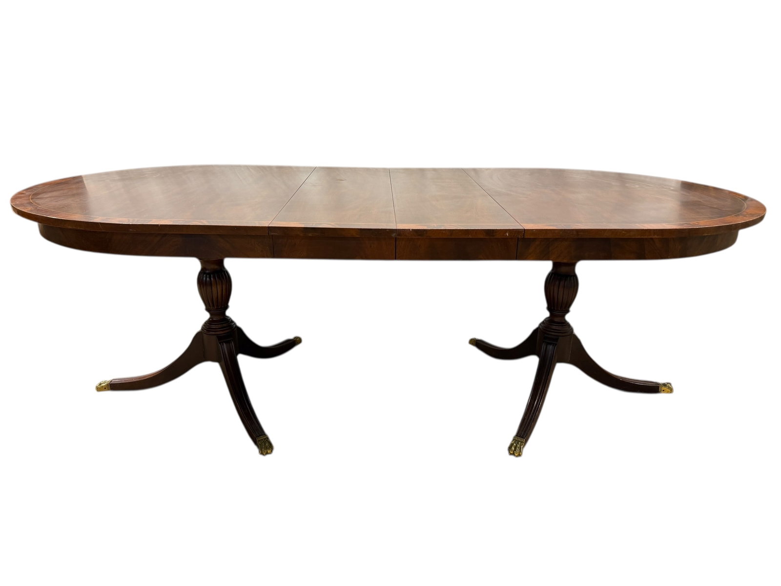 Henkel-Harris Georgian Mahogany Banded Inlay Dining Table: Henkel-Harris Georgian Mahogany Banded Inlay Dining Table. Double Pedestal and 2 leaves. Henkel-Harris label on the underside and Henkel-Harris stamps on the pedestals. Measures 30.25" H x 66" W x 44"
