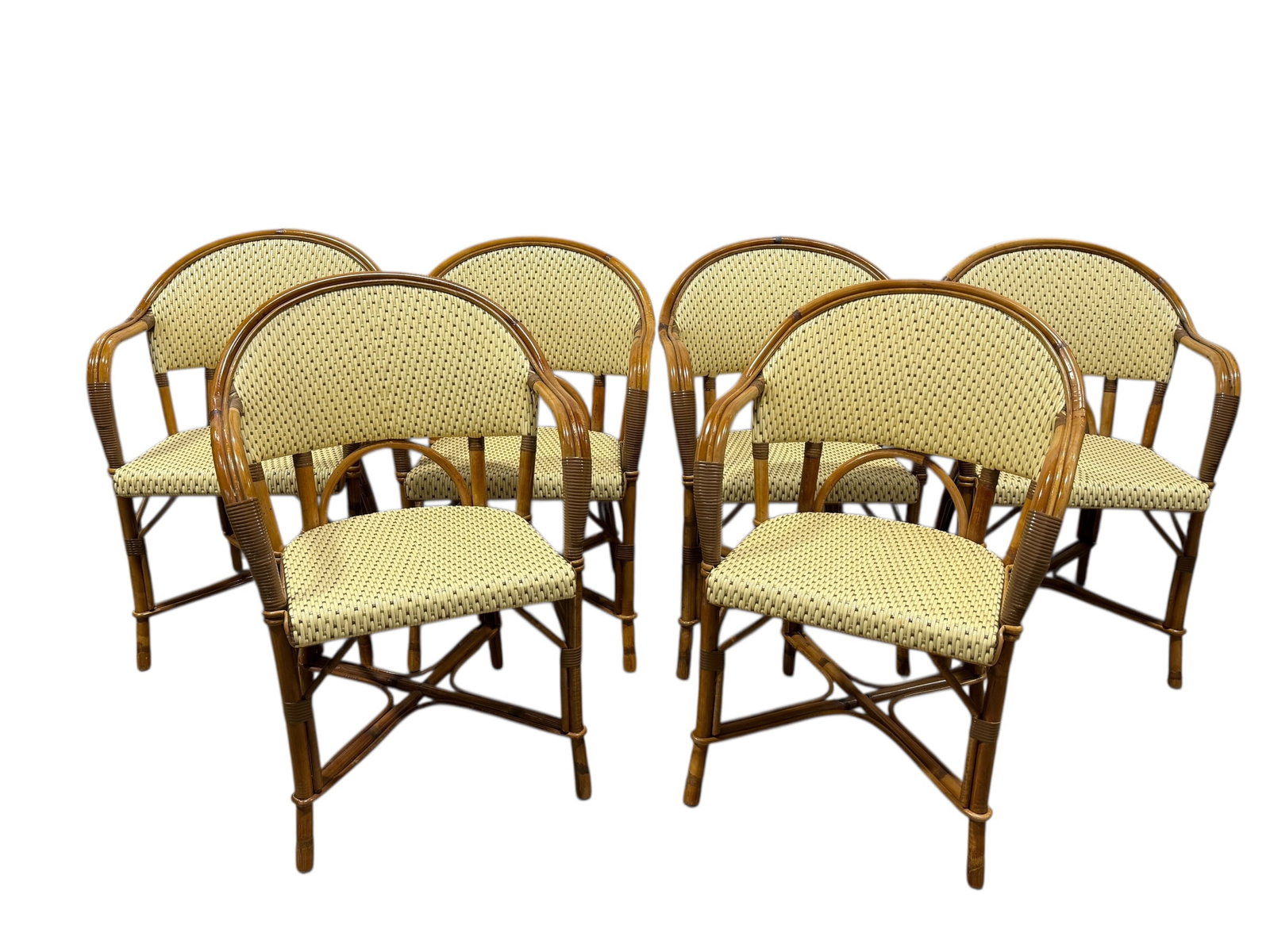 Set of 6 Maison Drucker French Café Rattan Chairs: Set of 6 Maison Drucker Café Rattan Chairs. Rattan and vinyl chairs. Label on the back of chairs. Measures 33.5" H x 22.25" W x 21" D. Seat height measures 18.5" H.