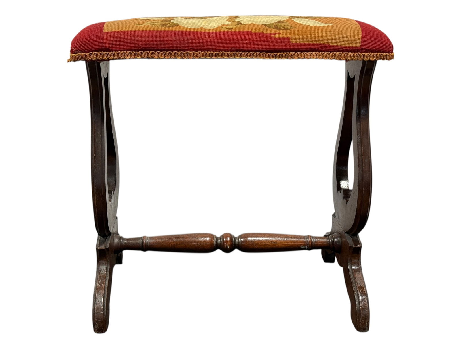 Antique Needlepoint Footstool: Antique Needlepoint Footstool. Measures 20" H x 20.5" W x 12.75" D.