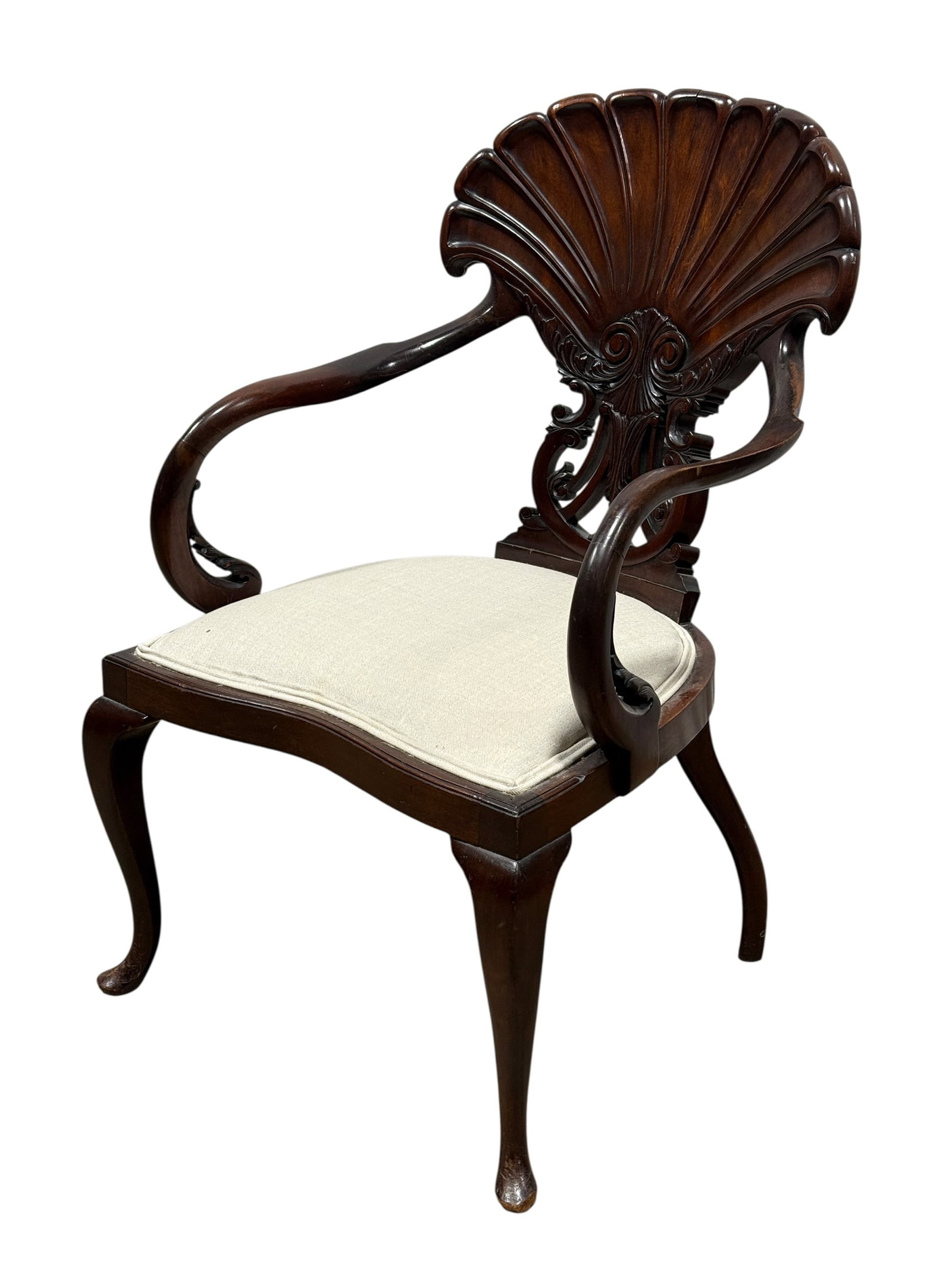 Late 19th C. Mahogany English Grotto Style Arm Chair: Late 19th C. Mahogany English Grotto Style Arm Chair. The armrests are slightly curved inward and end in C-shaped curves with carved acanthus leaves. The articulated backrest features scalloping above