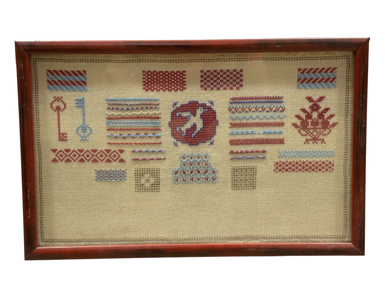 Framed Laura Holtorf Collins Needlepoint Sampler: Framed Laura Holtorf Collins Needlepoint Sampler. Bio on the back. Measures 19" x 12". Frame has some scratches and chips.