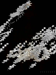 Capodimonte Blanc de Chine Porcelain 16 Arm Chandelier: Capodimonte Blanc de Chine Porcelain 16 Arm Chandelier. 12 Lights and 4 regular arms. All arms are removeable. Capodimonte stamp on the underside. Measures 27.75" H x 25.5" W x 25.5" D. 1 non-light ar