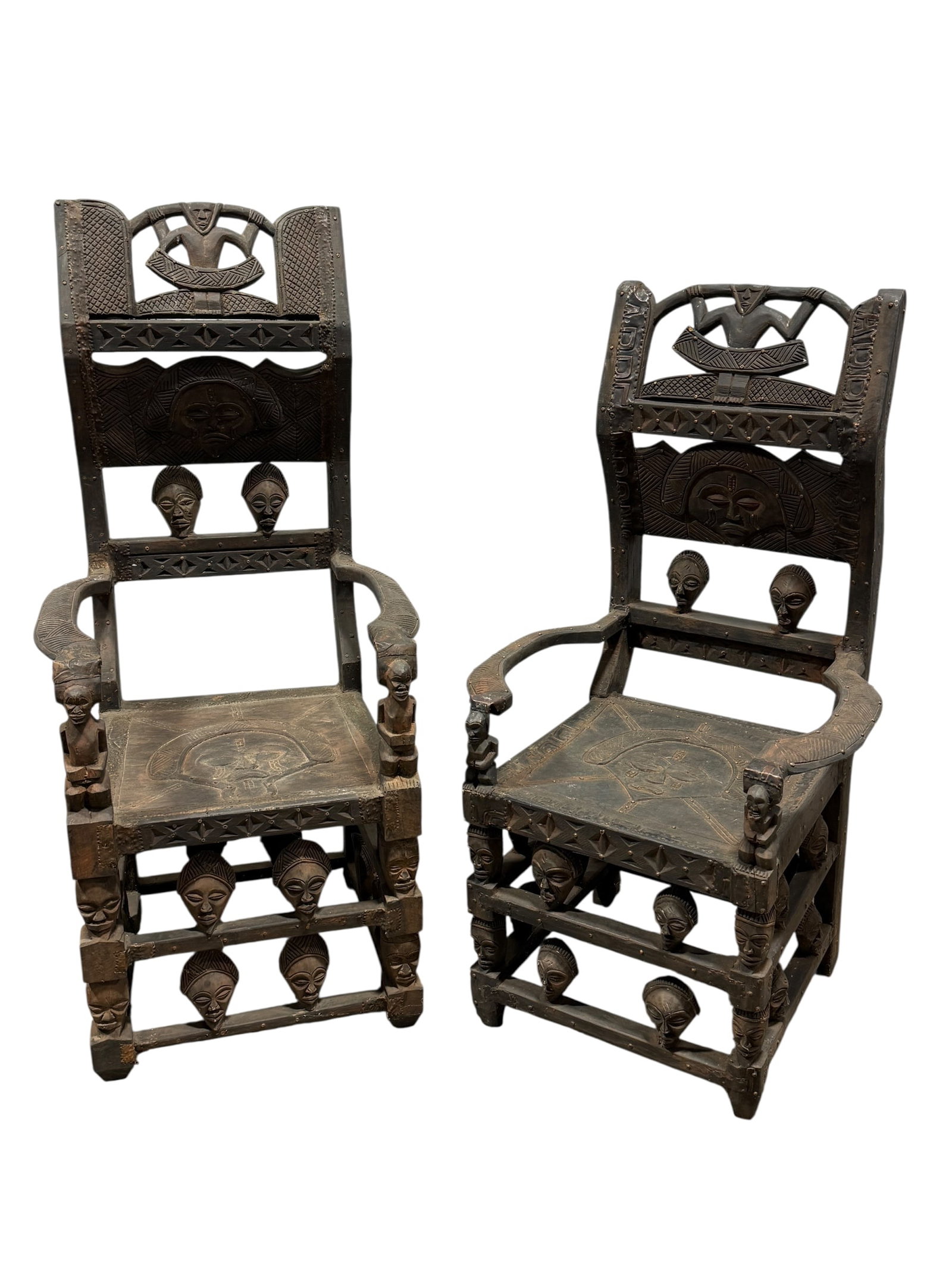 Pair of African Chokwe Carved Wood Throne Chairs: Pair of African Chokwe Carved Wood Throne Chairs. Measures 53" H x 24.5" W x 22.5" D & 48.25" H x 26" W x 22" D. Seat height measures 18" H for both. Has scuffs, scratches and some small chips.