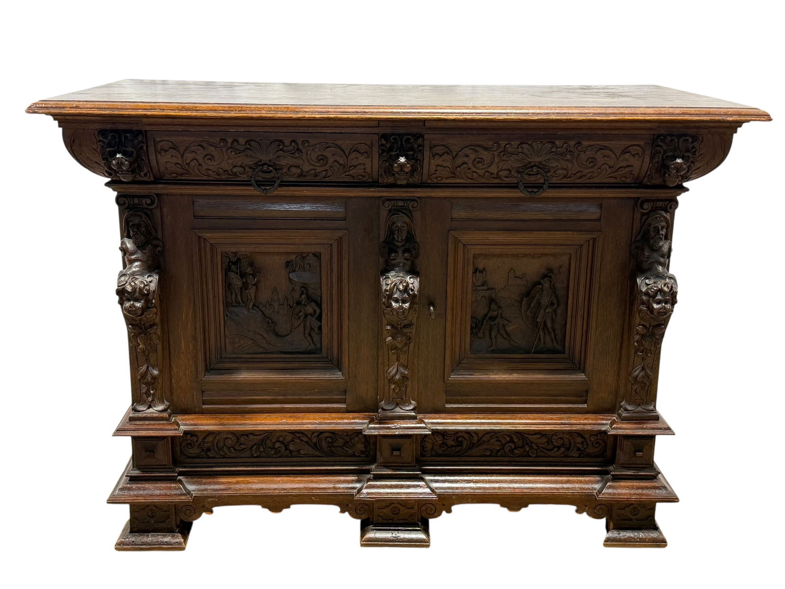 RARE 19th C. Oak German "Gebr. Trimborn Mobelfabrik Koln" Server: RARE 19th C. Oak German "Gebr. Trimborn Mobelfabrik Koln" Server. Manufactured by Meller Mobelfabrik in Meller, Germany (1870-1908). Has label on the inside. Very well carved faces and scenes thoughou