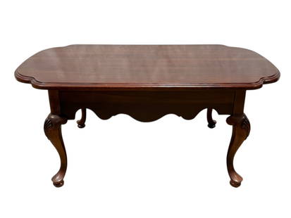 Lexington Queen Anne Style Coffee Table: Lexington Queen Anne Style Coffee Table. Marked Lexington on the underside. Measures 18.25" H x 42" W x 25" D. Has some surface scratches.