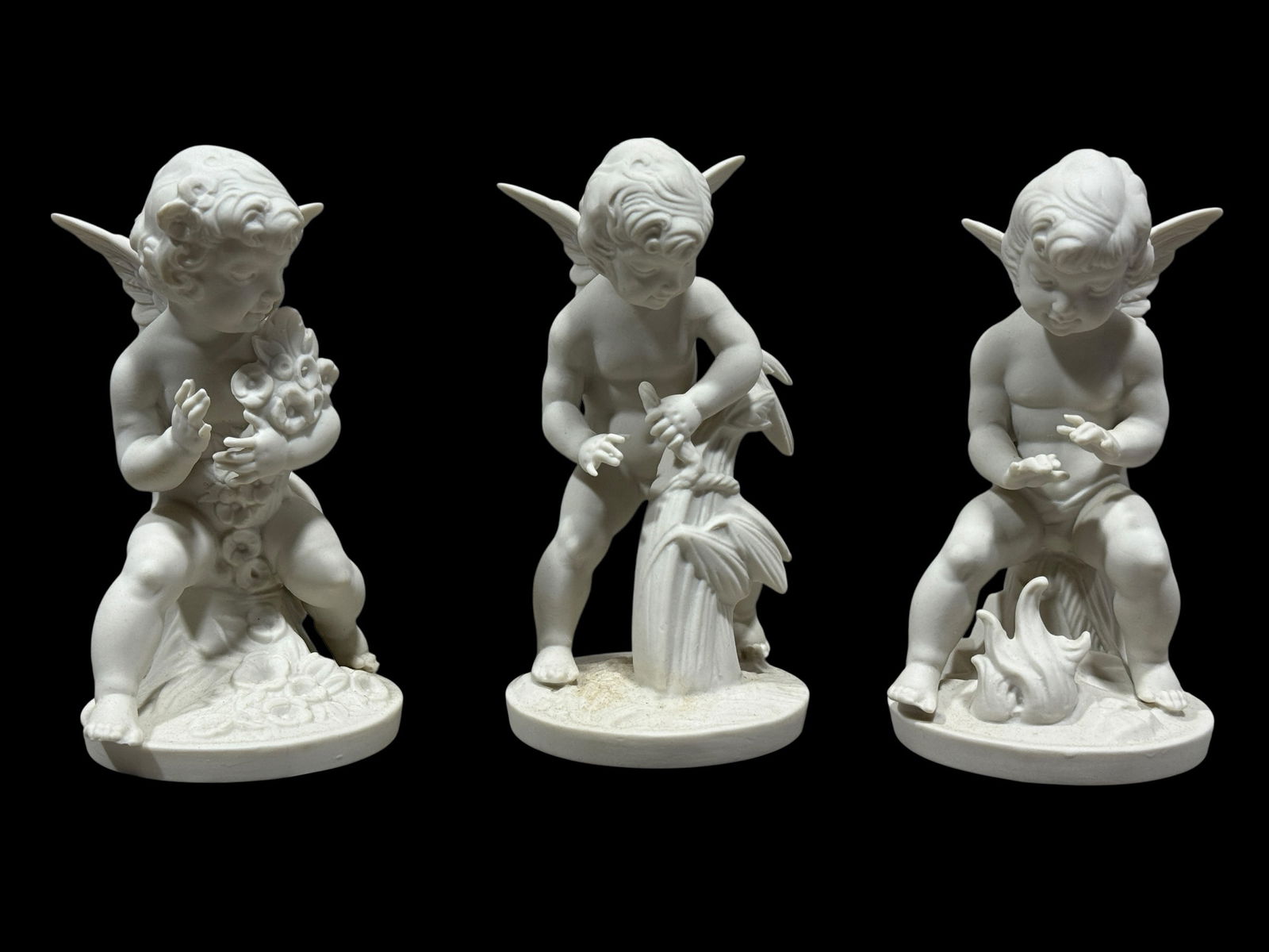 Set of 3 Dresden White Bisque Porcelain Cherub Figures: Set of 3 Dresden White Bisque Porcelain Cherub Figures. Marked Dresden, Germany under all. Measures approx. 5.75" Tall each.