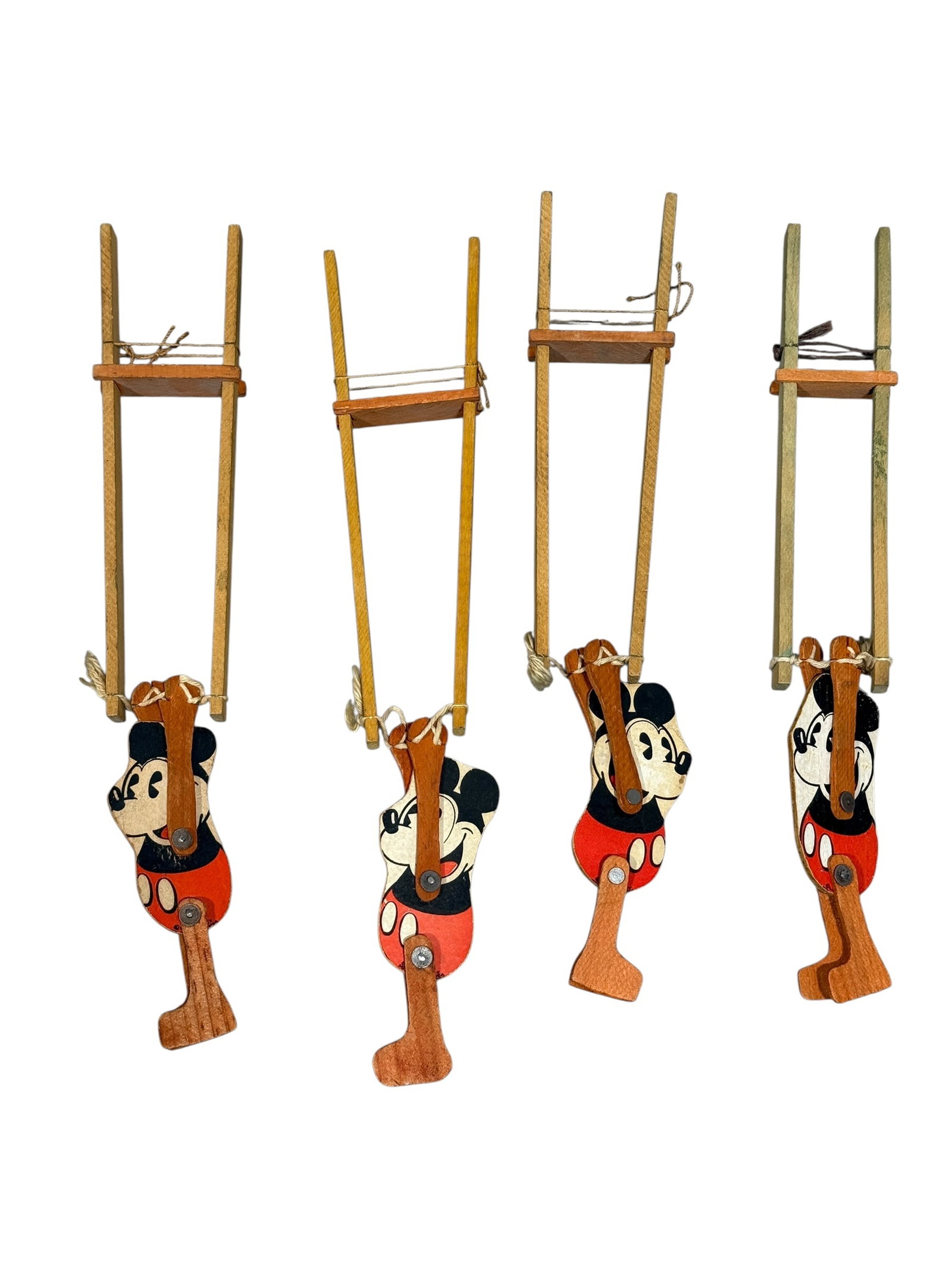 Group of 4 Wooden Walt Disney Mickey Mouse Trapeze Toys: Group of 4 Wooden Walt Disney Mickey Mouse Trapeze Toys. Marked Walt Disney on all. Measures 12.5" Long, 13.25" Long & 13.5" Long. Has some scuffs.