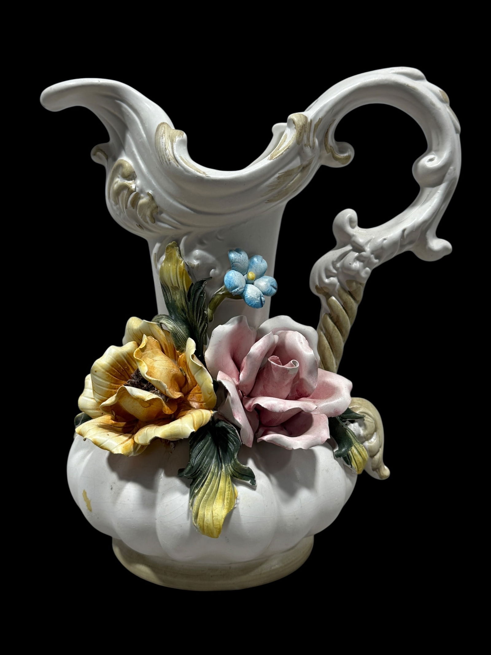 Italian Capodimonte Porcelain Pitcher Vase: Italian Capodimonte Porcelain Pitcher Vase. Marked Made in Italy with Capodimonte symbol on the underside. Measures 10" H x 8.25" W x 6" D. In good condition.
